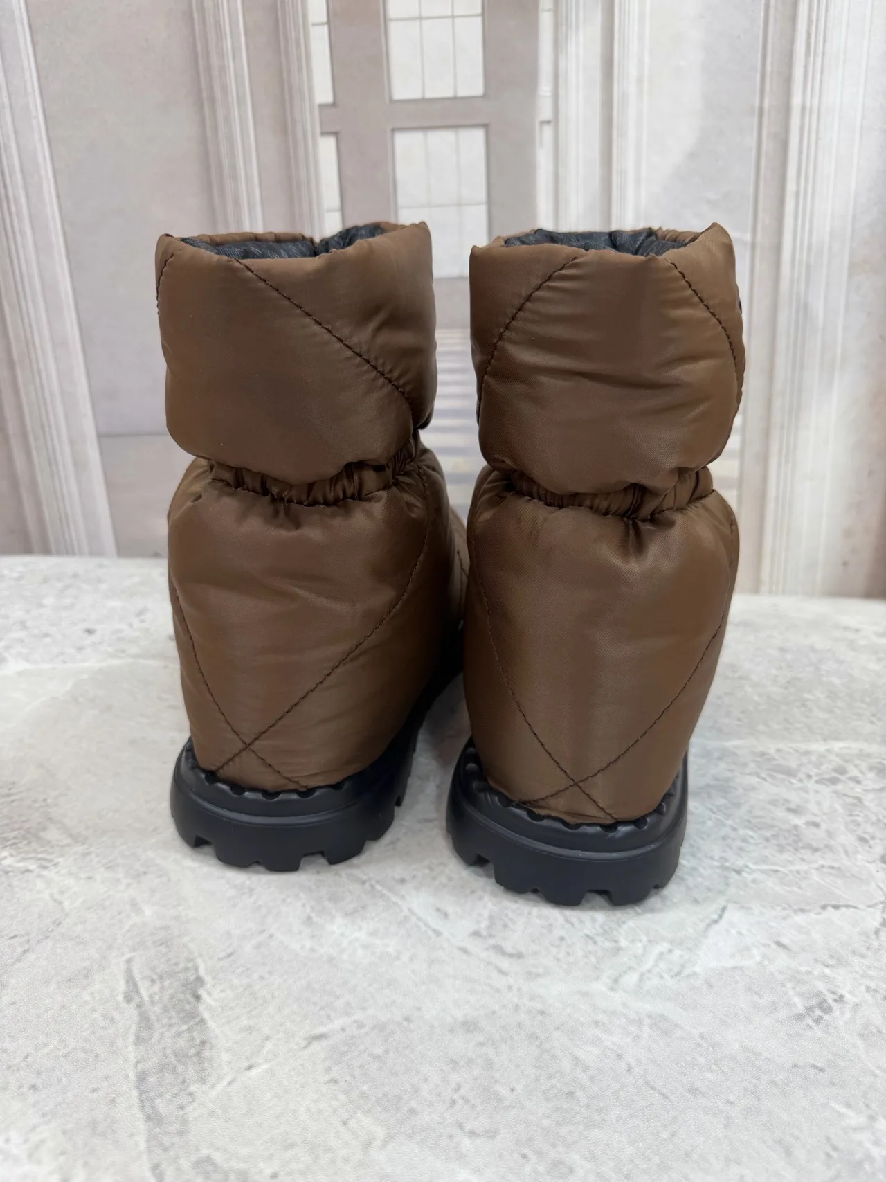 Prada Quilted Round-Toe Puffer Boots in Brown · view 6
