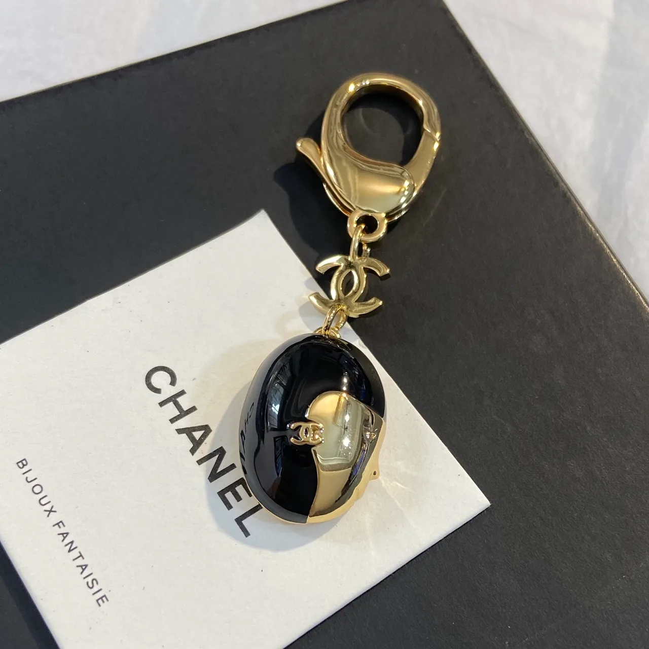 Chanel Face Keychain in Black · view 2