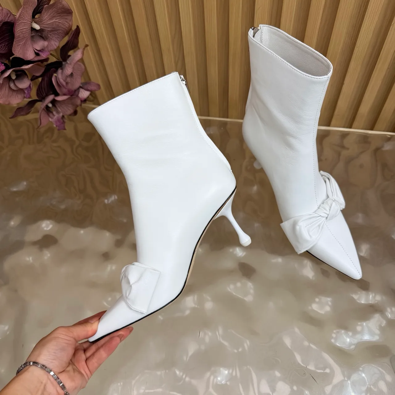Jimmy Choo Cowhide Glossy Pointed-Toe Bow Ankle Boots in White · view 8