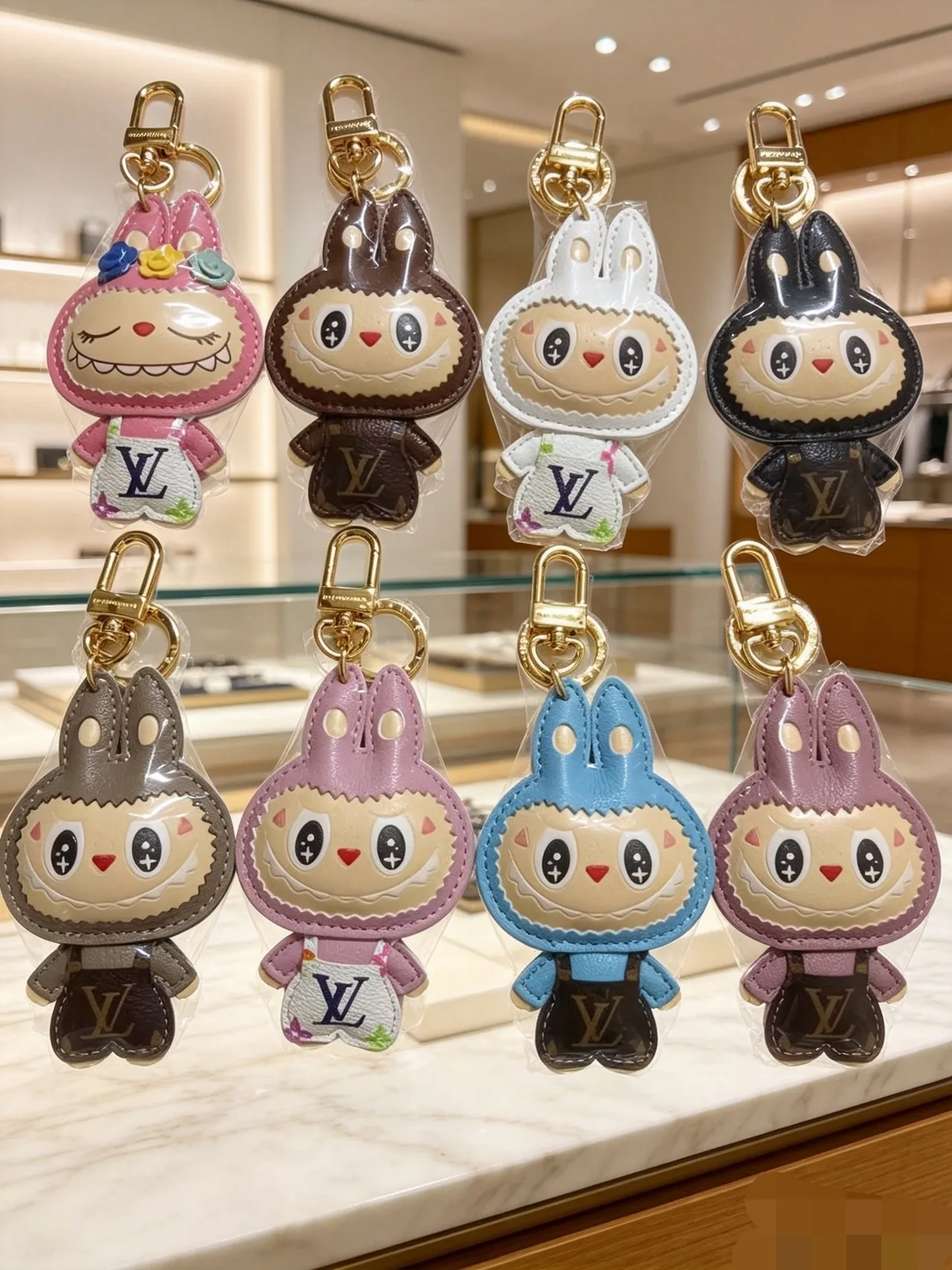 Louis Vuitton Printed Bunny Figure Keychain in Pink & Brown & White & Black & Grey & Purple & Blue · view 1