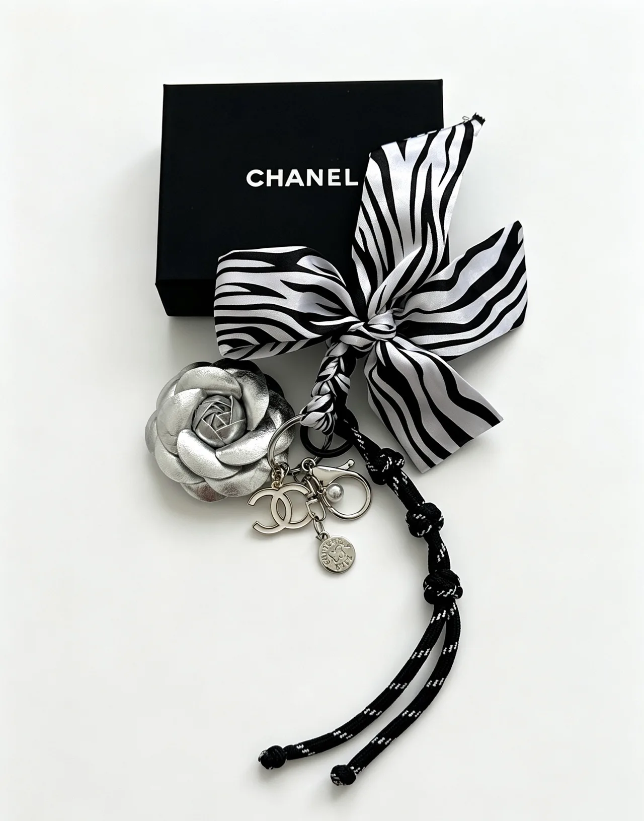 Chanel Striped Camellia Keychain in Silver · view 3