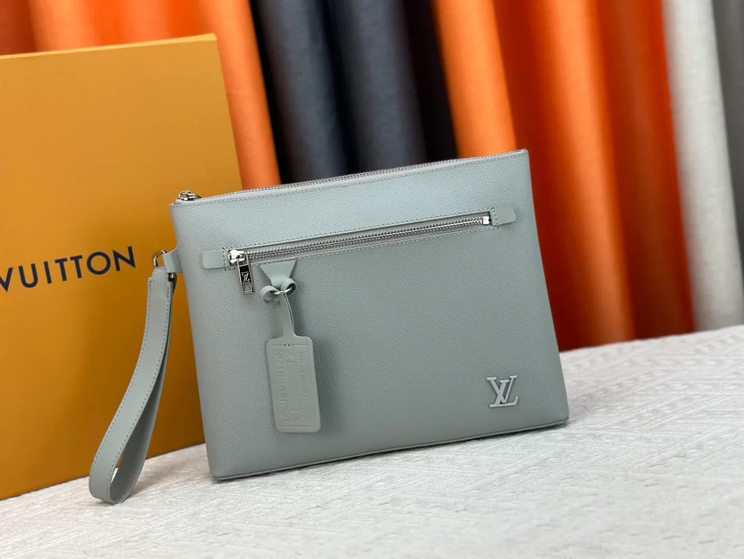 Louis Vuitton Cowhide Clutch in Grey · view 1