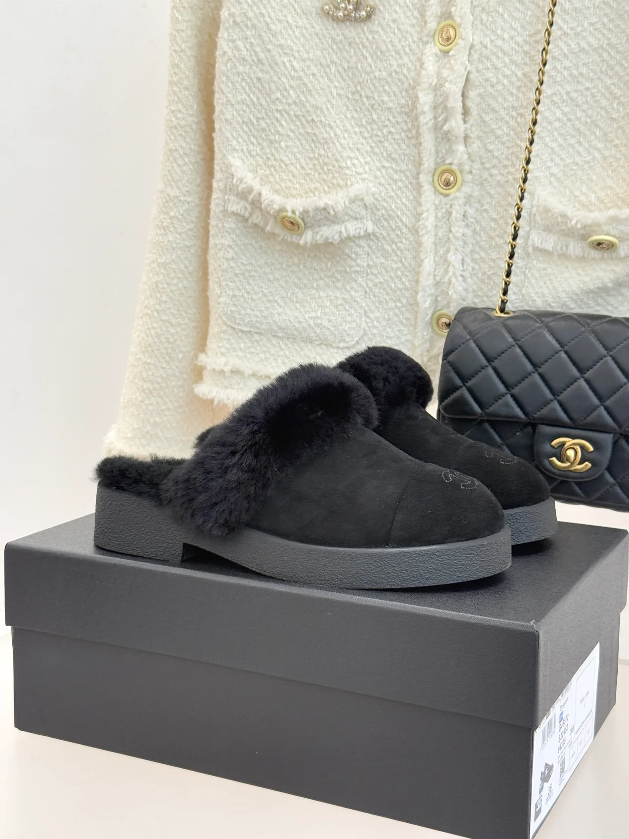 Chanel Glossy Suede-Look Slippers in Black · view 1