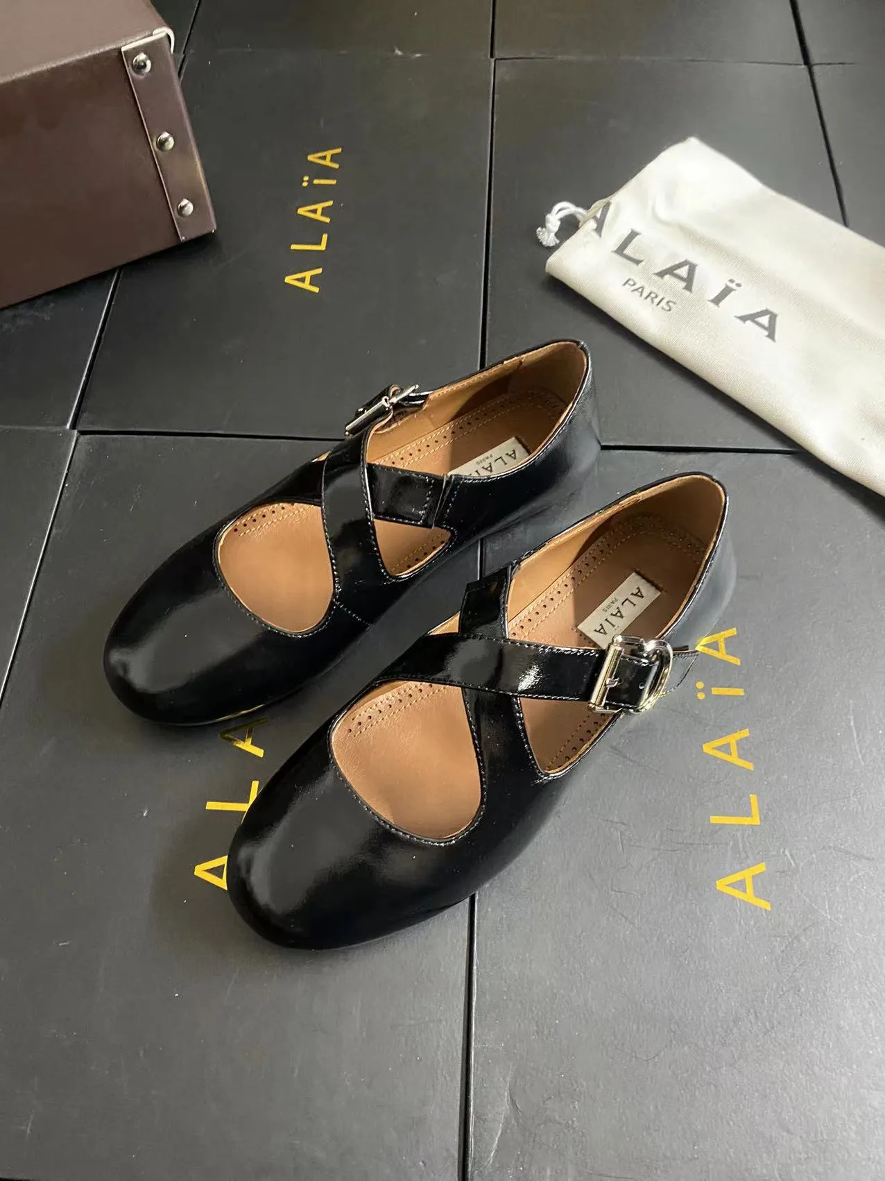 Alaia Cowhide Sheepskin Glossy Square-Toe Buckle Cross-Strap Flats in Black · view 5
