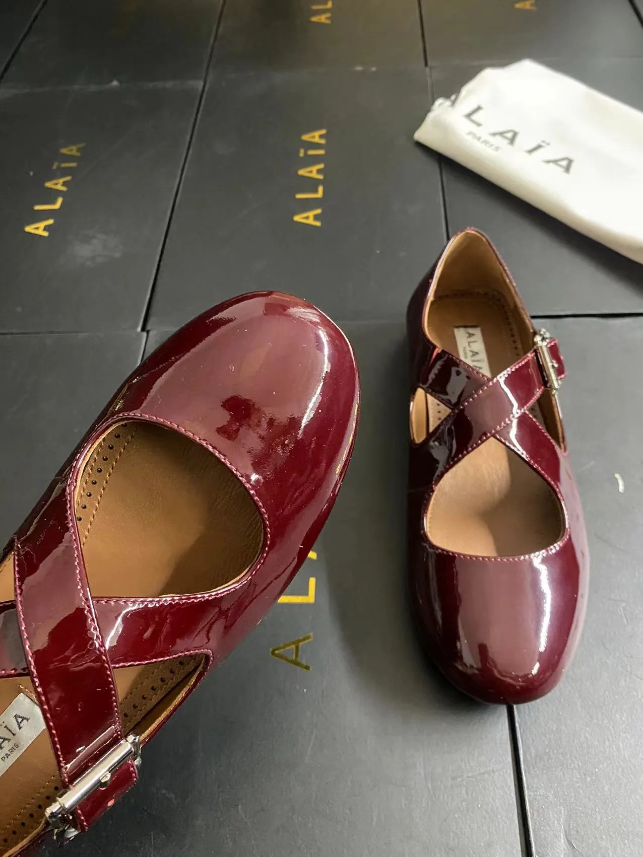 Alaia Cowhide Sheepskin Glossy Square-Toe Buckle Cross-Strap Mary Jane Flats in Burgundy · view 8
