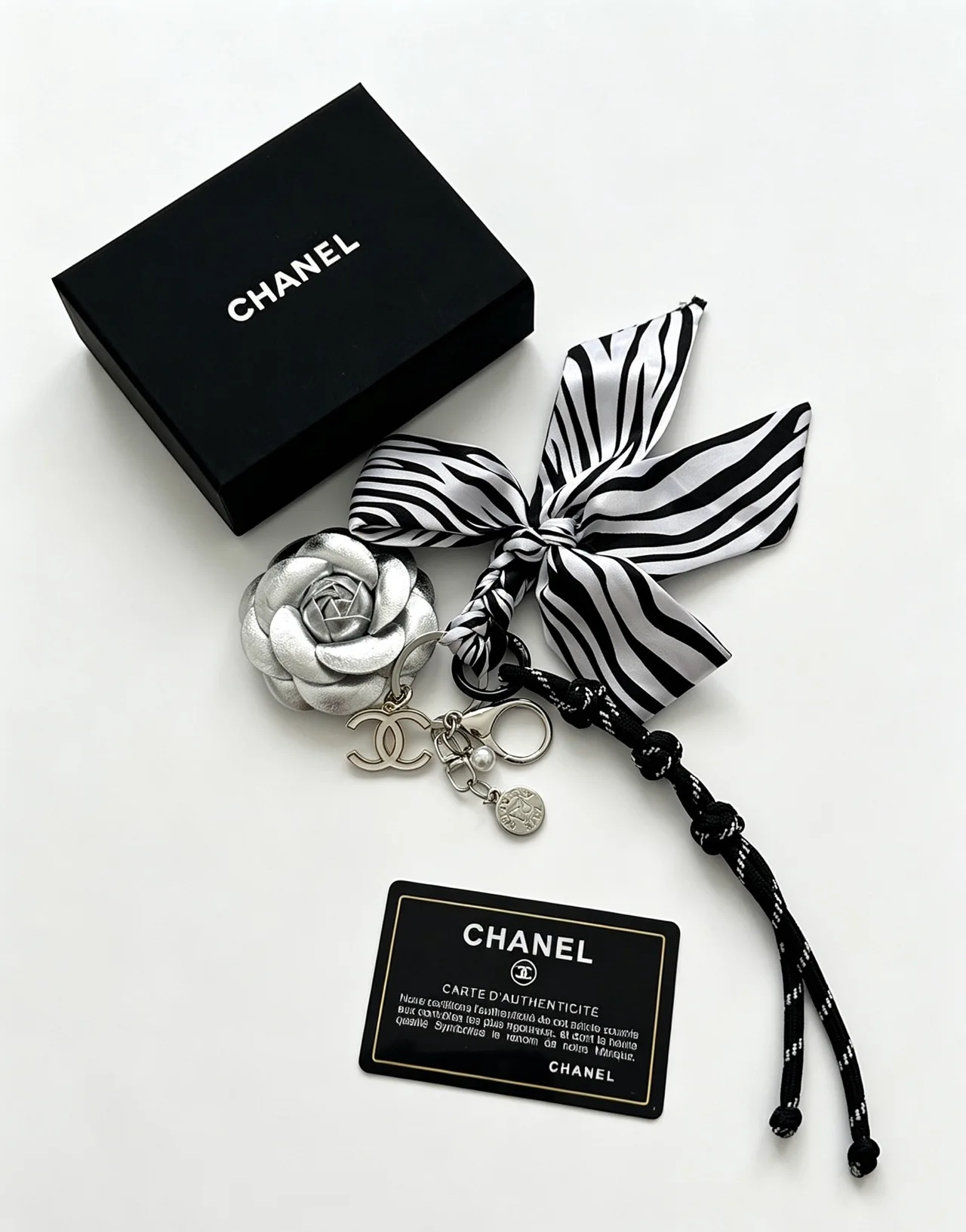 Chanel Striped Camellia Keychain in Silver · view 2