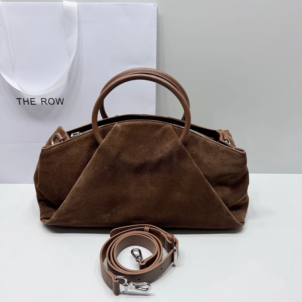 The Row Smooth Top-Handle Bag in Brown · view 1