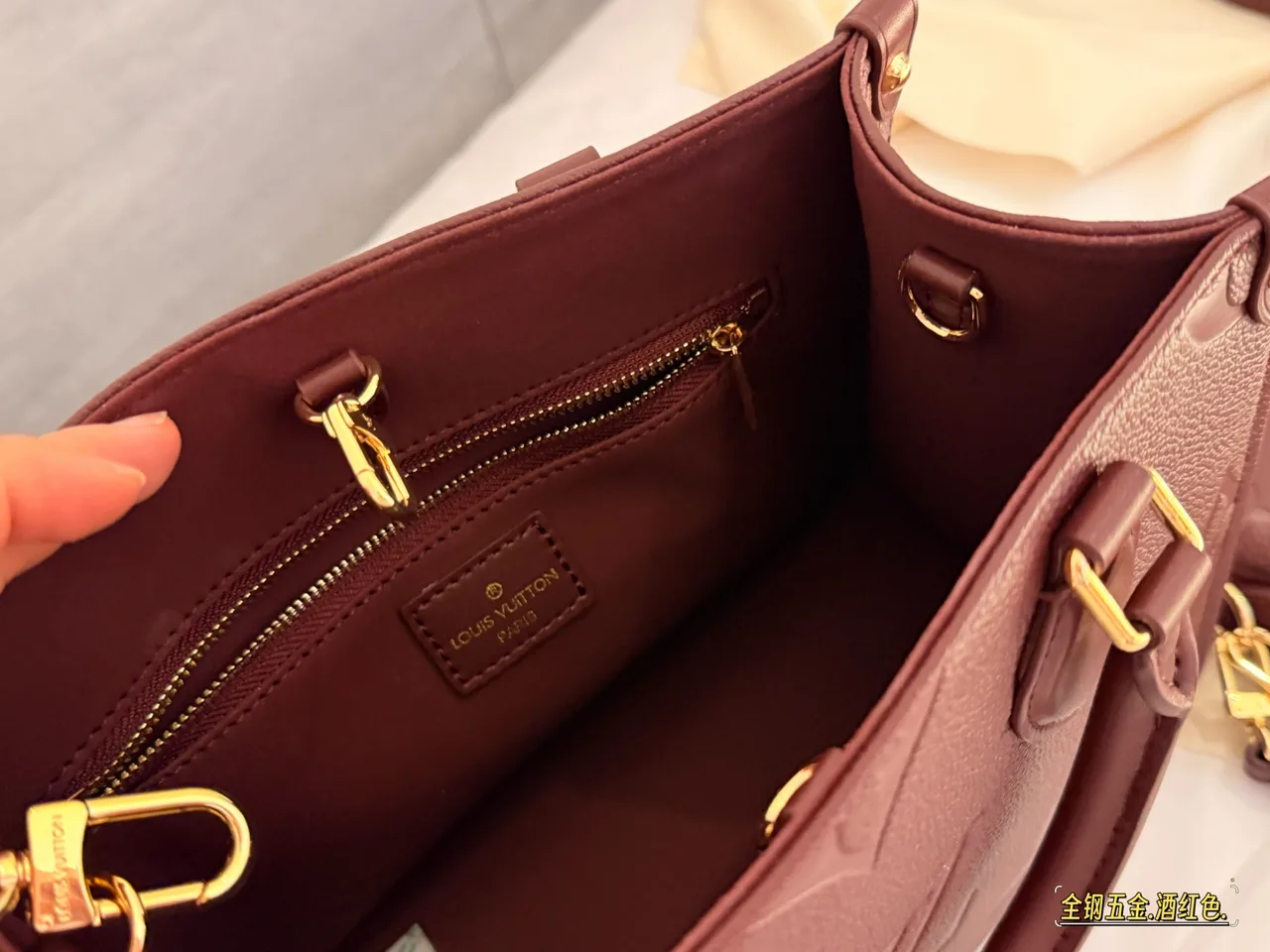 Louis Vuitton OnTheGo Embossed Monogram Zip-Compartment Tote in Burgundy · view 3