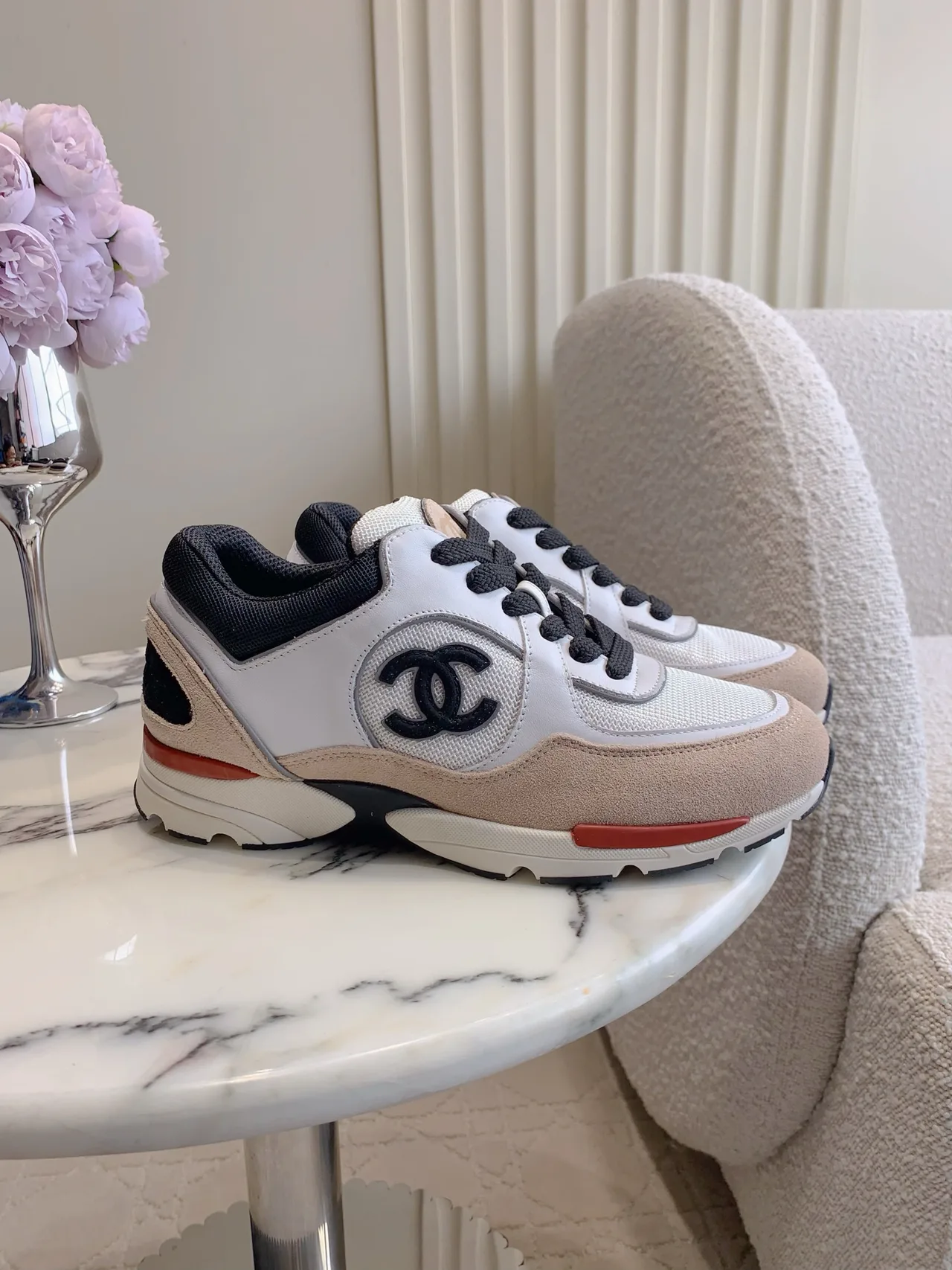 Chanel Quilted Sneakers in White · view 1