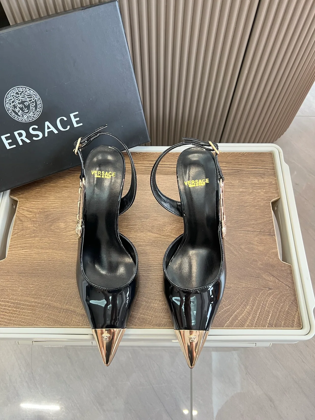 Versace Glossy Pointed-Toe Pointed Slingback Pumps in Black · view 1