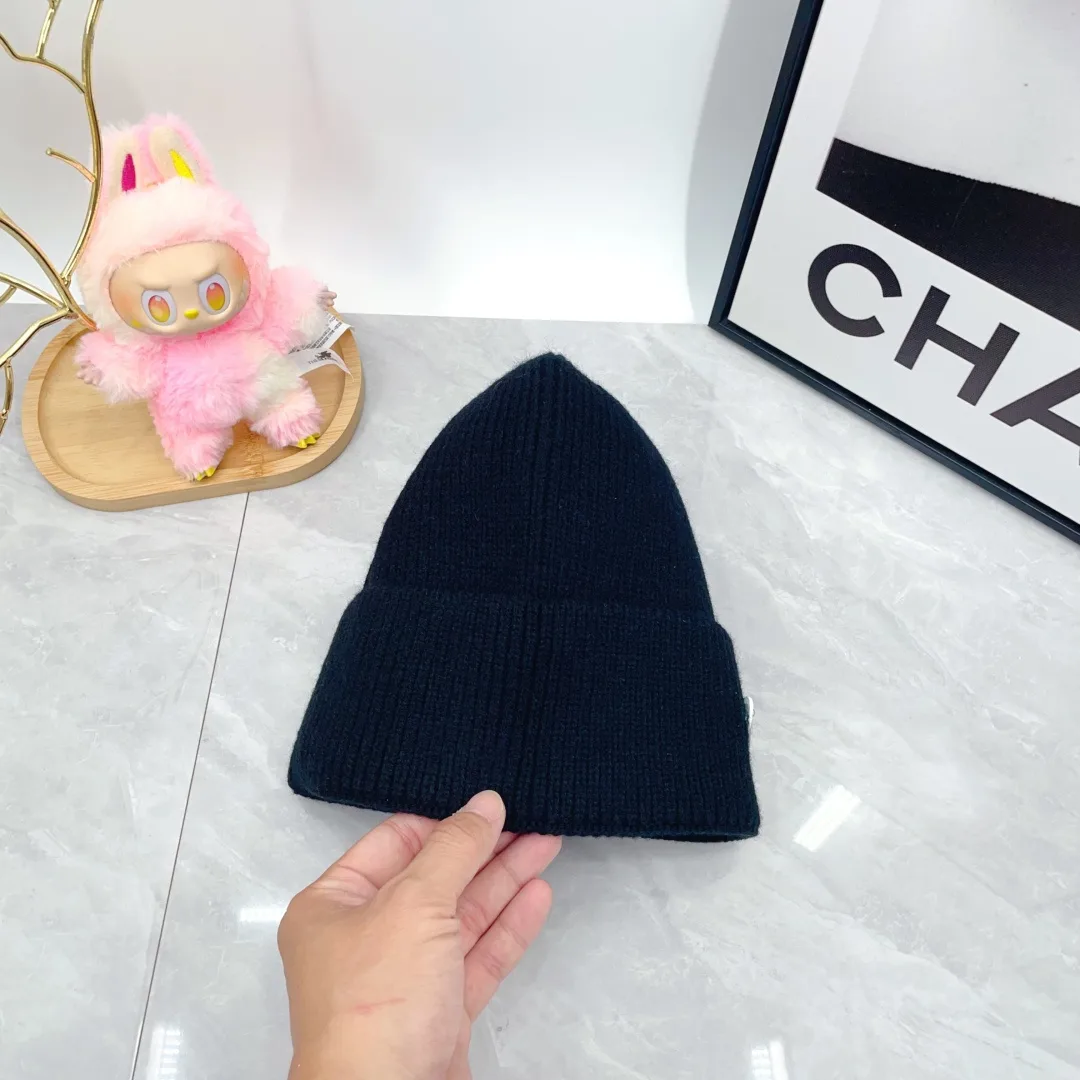 Prada Wool Triangle Logo Knit Beanie in Black · view 5