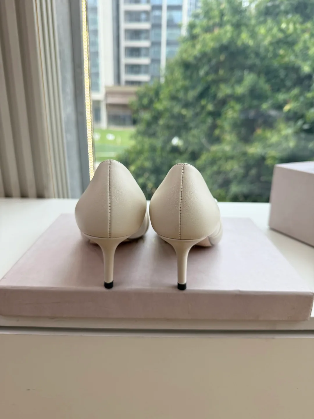 Jimmy Choo Glossy Pointed-Toe Knotted Pointed Pumps in White · view 6