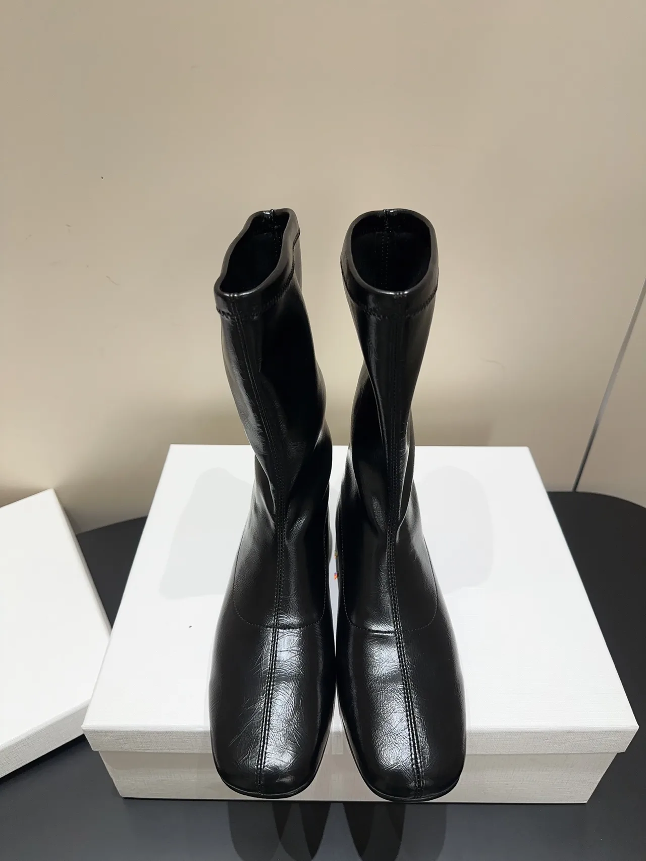 The Row Cowhide Sheepskin Glossy Round-Toe Ankle Boots in Black · view 1