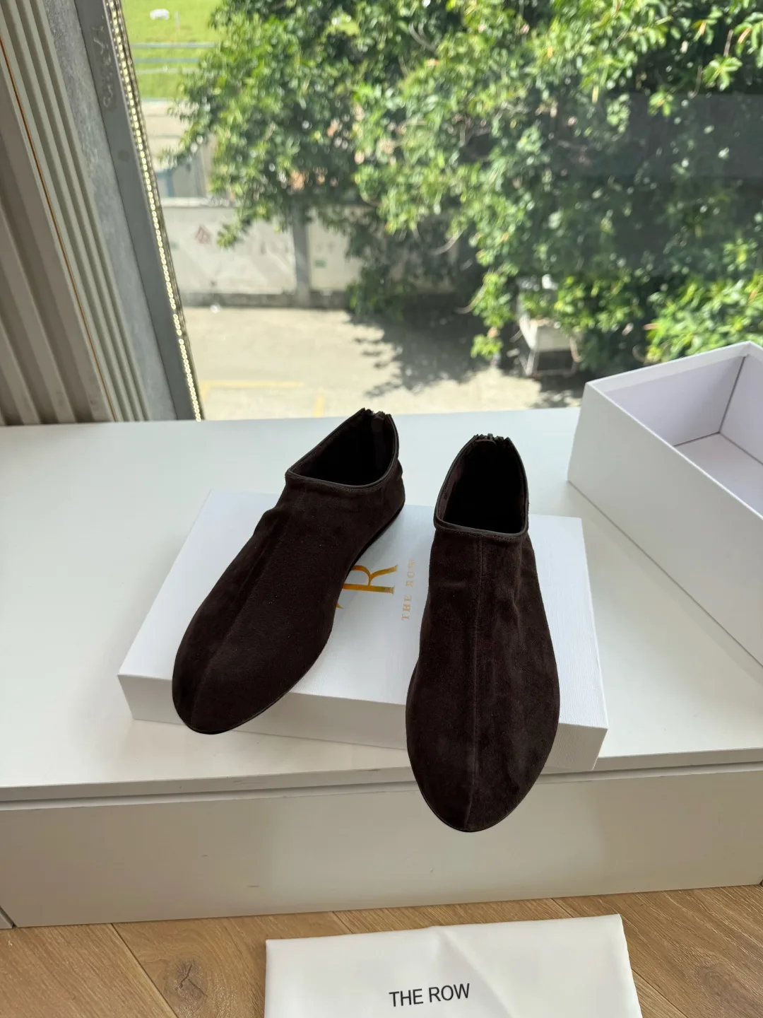 The Row Smooth Round-Toe Slip-On Flats in Brown · view 1