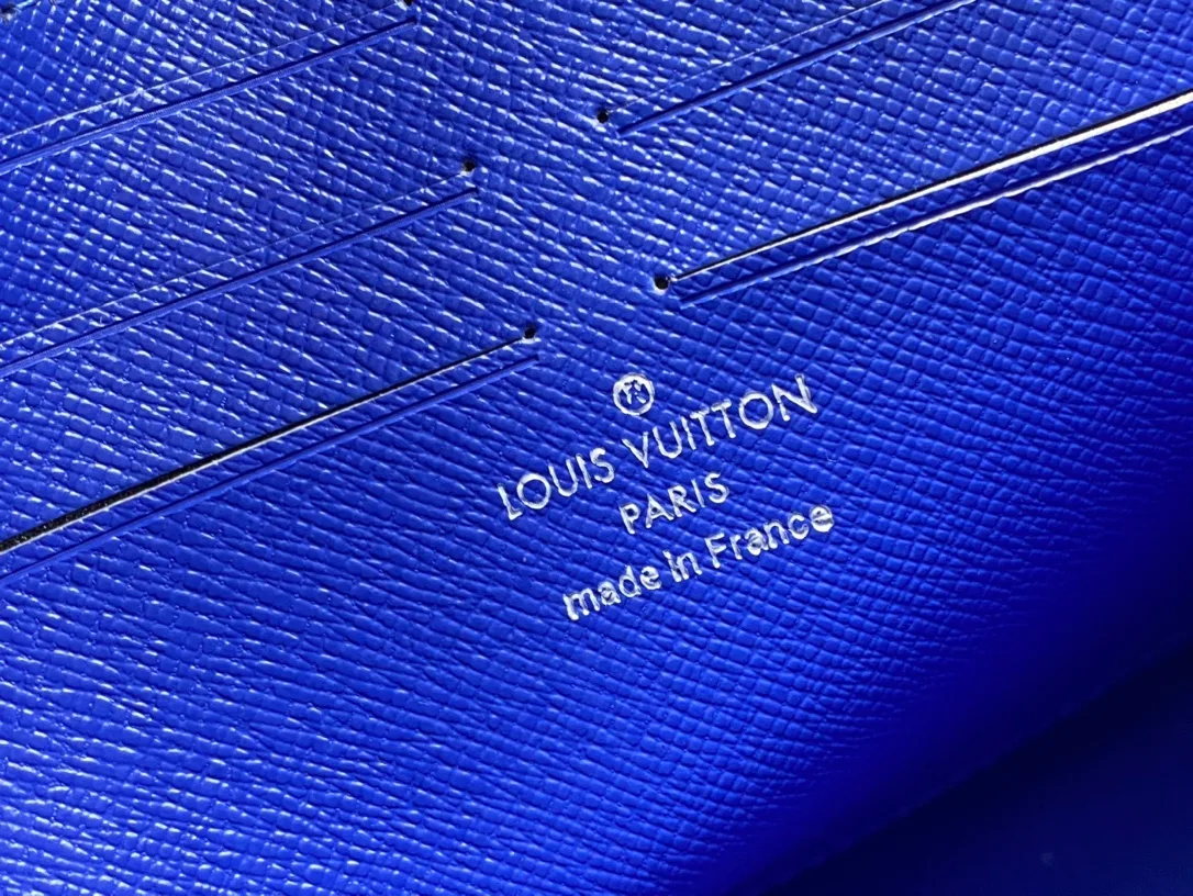 Louis Vuitton Cowhide Canvas Clutch in Blue · view 8