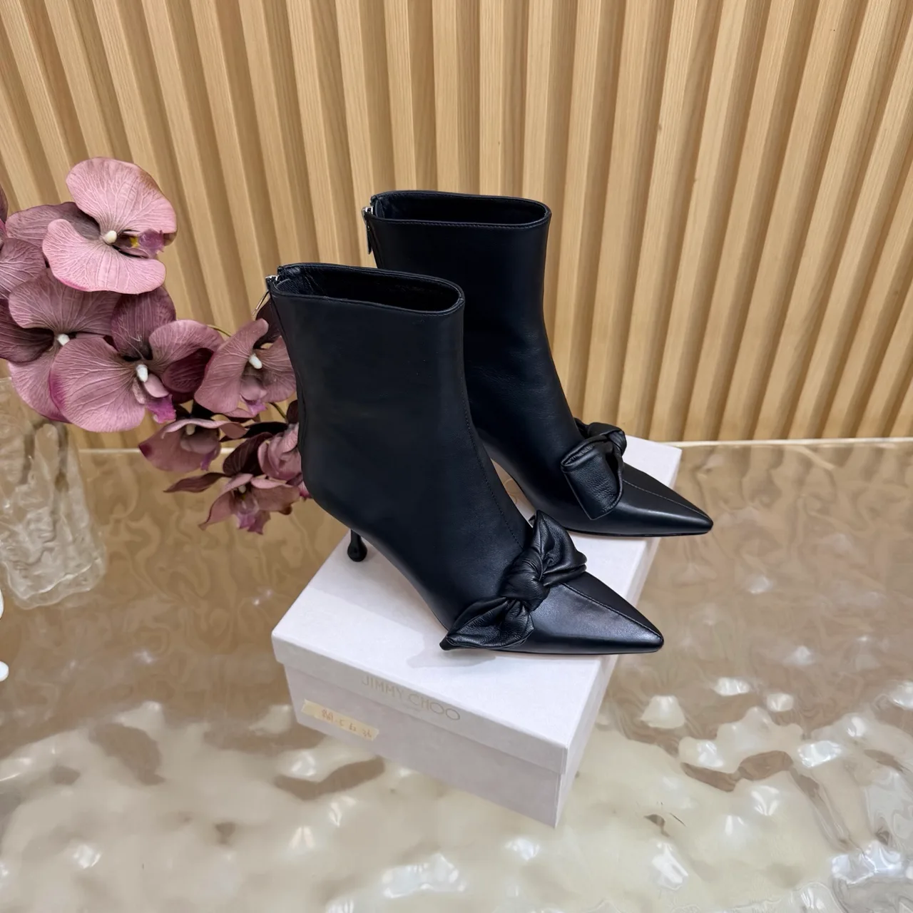 Jimmy Choo Cowhide Glossy Pointed-Toe Bow Knot Ankle Boots in Black · view 1