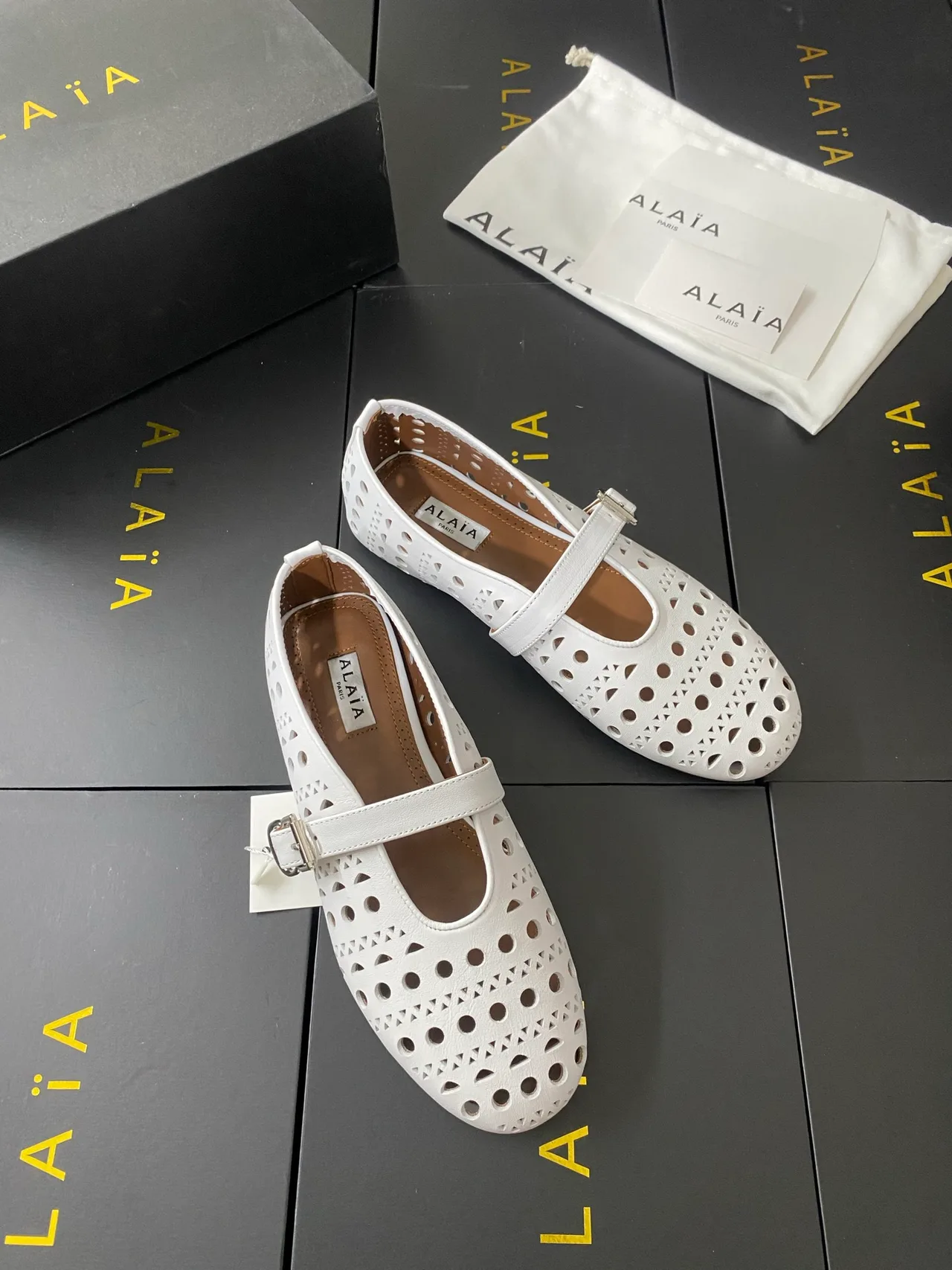 Alaia Cowhide Sheepskin Round-Toe Buckle Ballet Flats in White · view 4