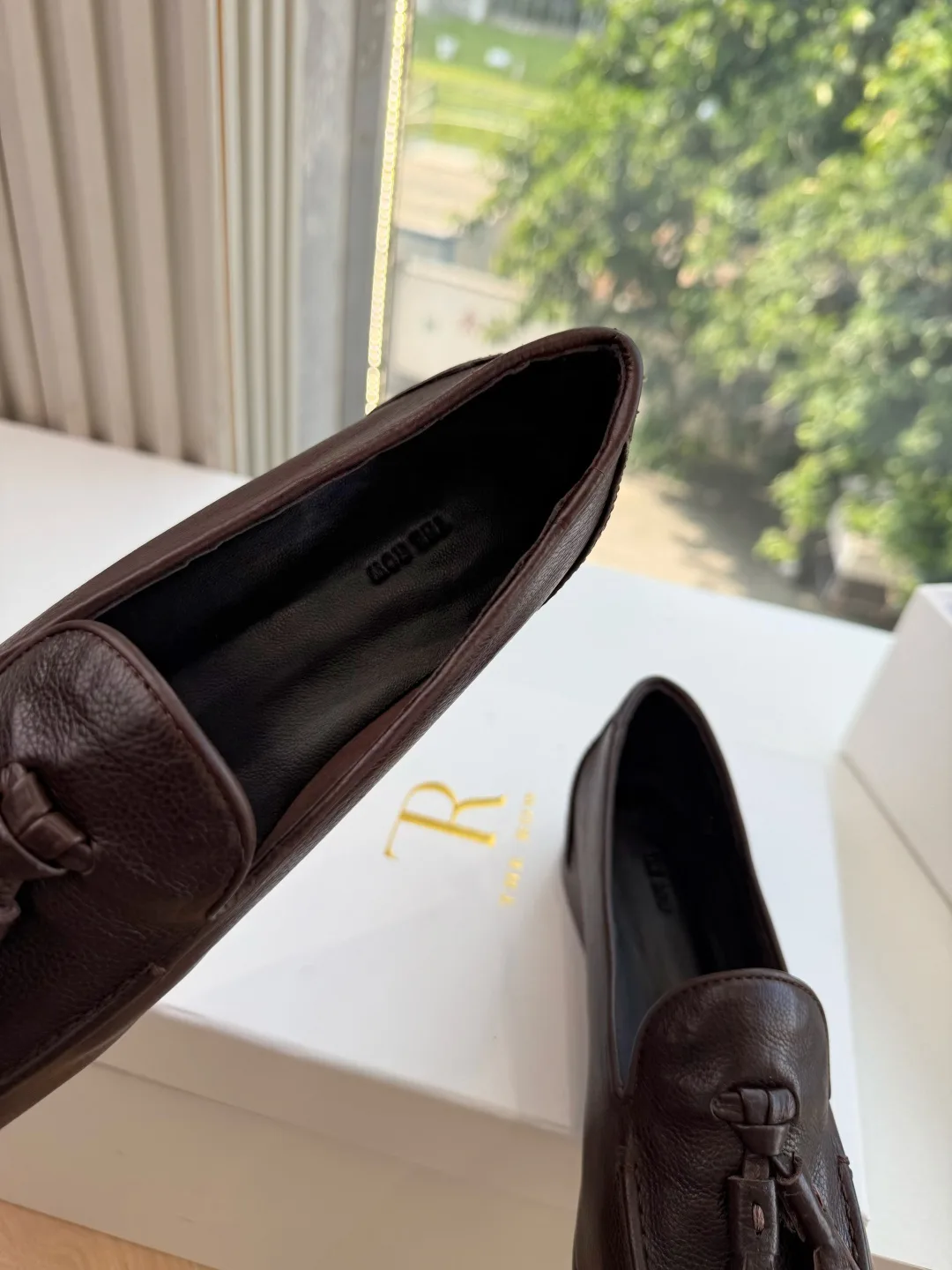 The Row Cowhide Glossy Round-Toe Tassel Loafers in Brown · view 7