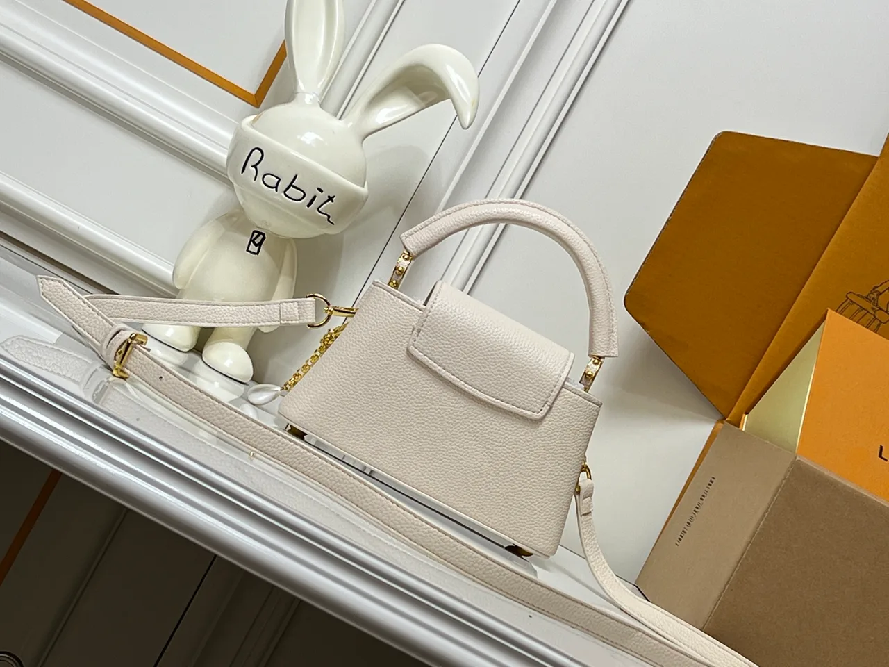 Louis Vuitton Cowhide Smooth Capucines East West Bag in Cream · view 6