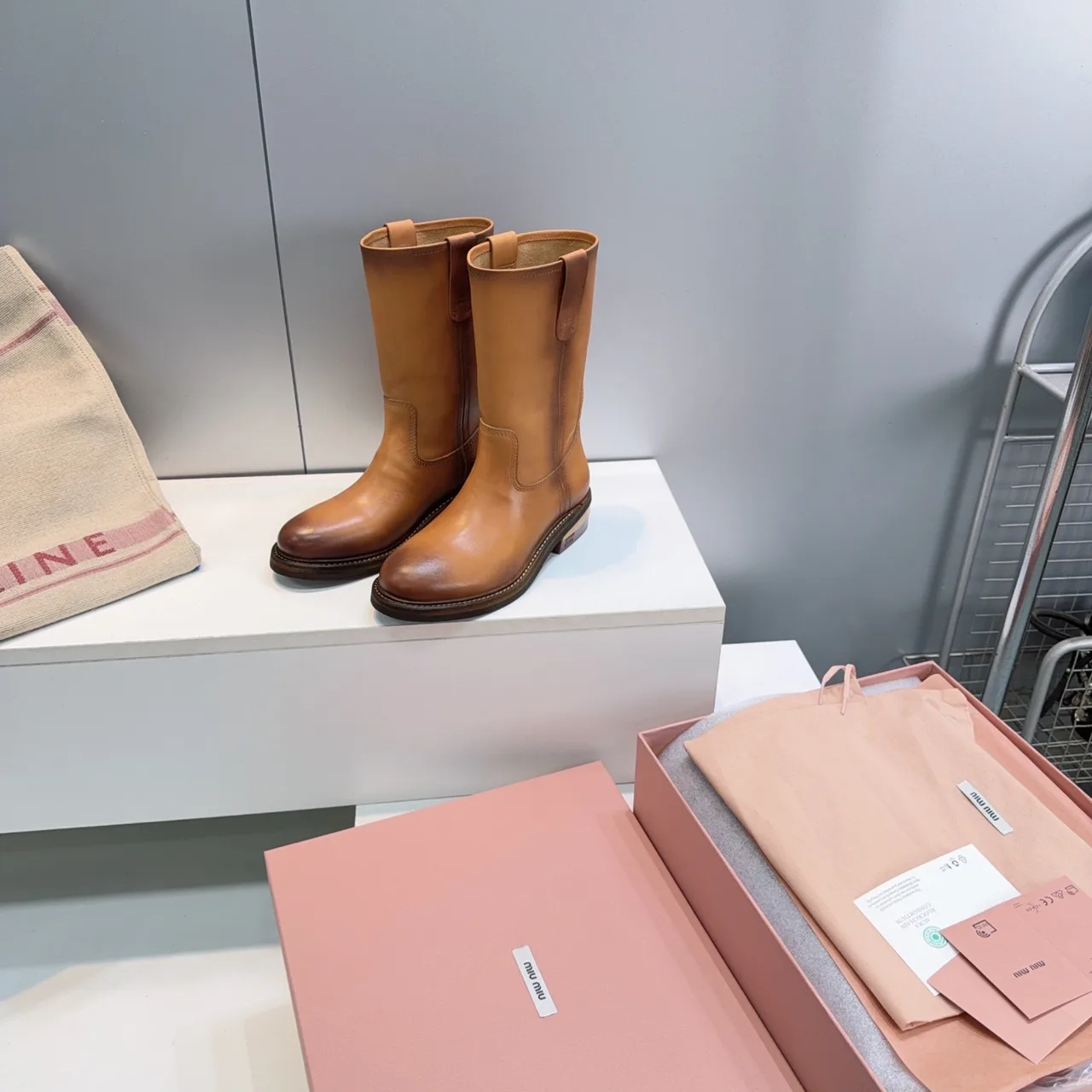 Miu Miu Cowhide Smooth Round-Toe Mid-Calf Boots in Brown · view 6