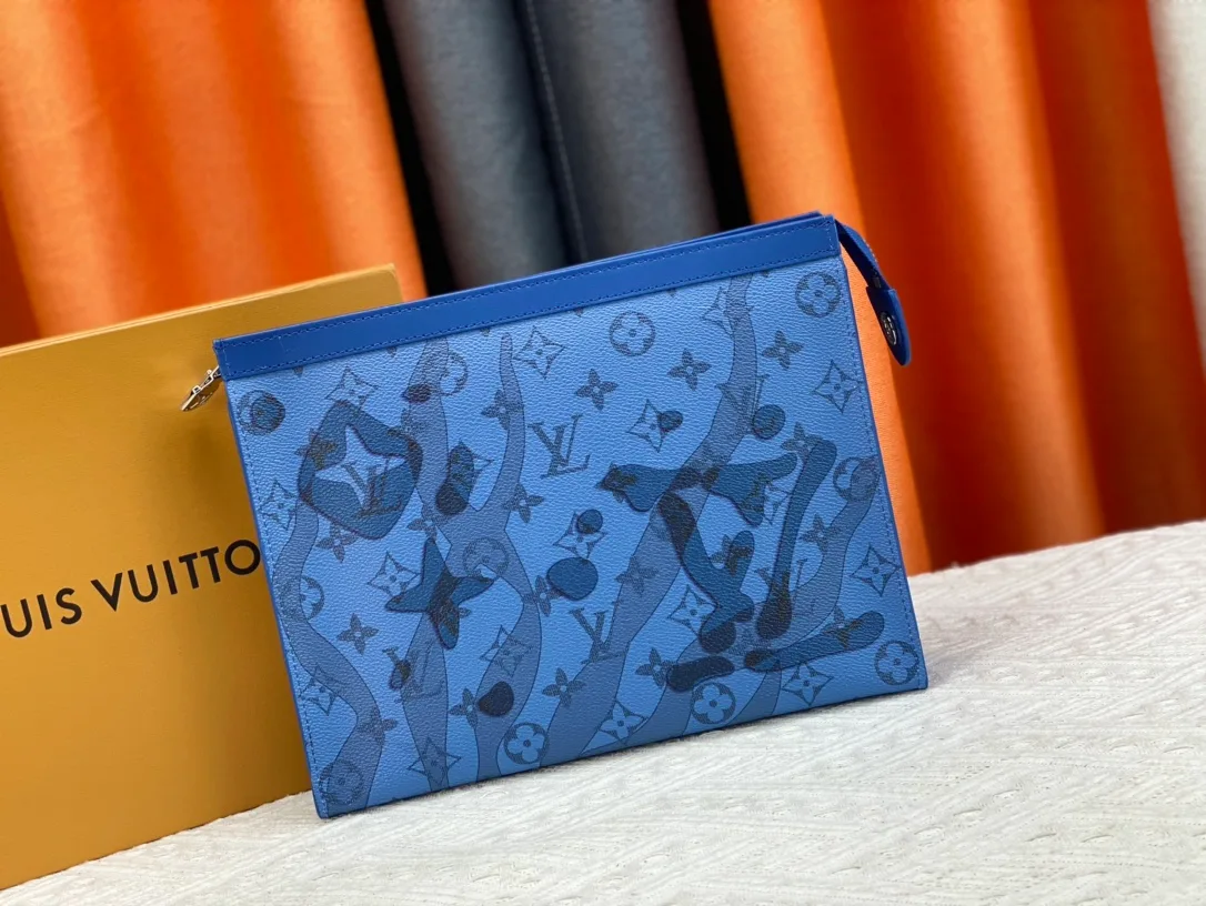 Louis Vuitton Cowhide Canvas Clutch in Blue · view 1
