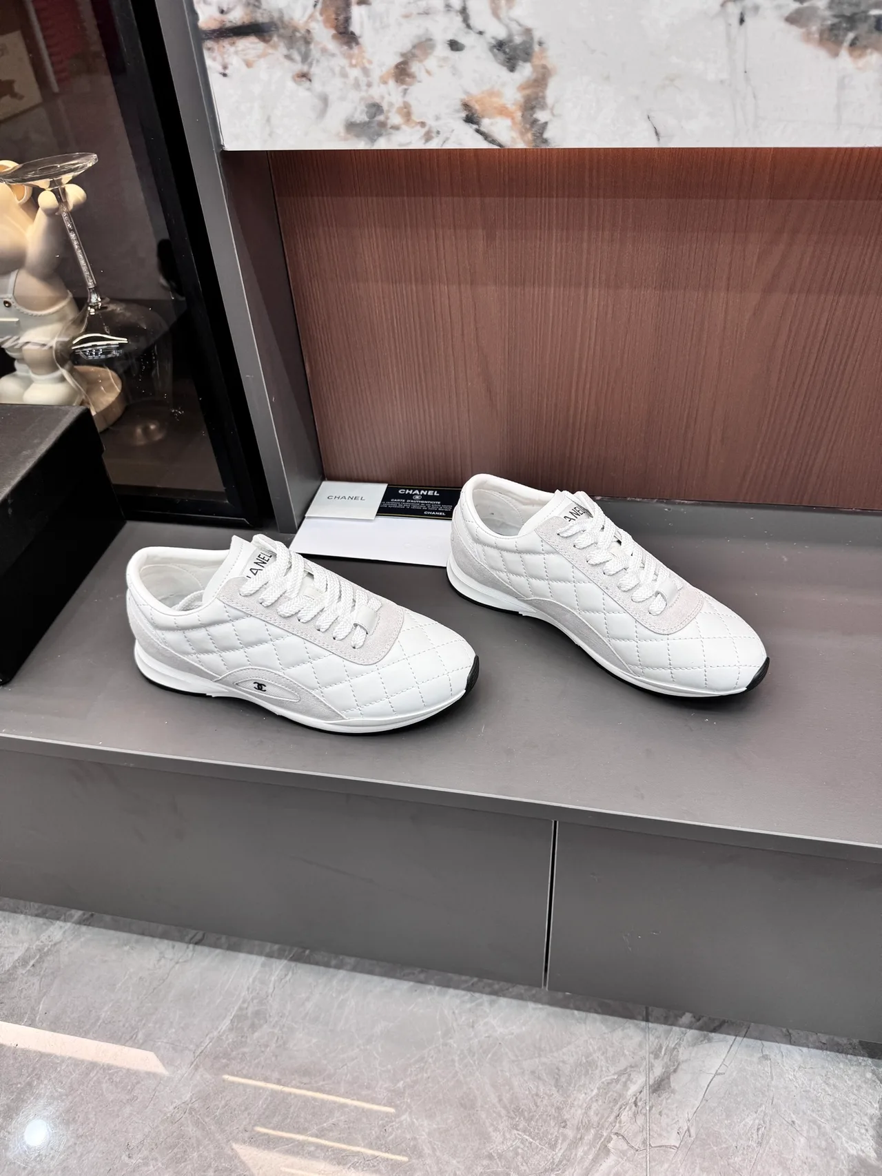 Chanel Quilted Glossy Sneakers in White · view 3