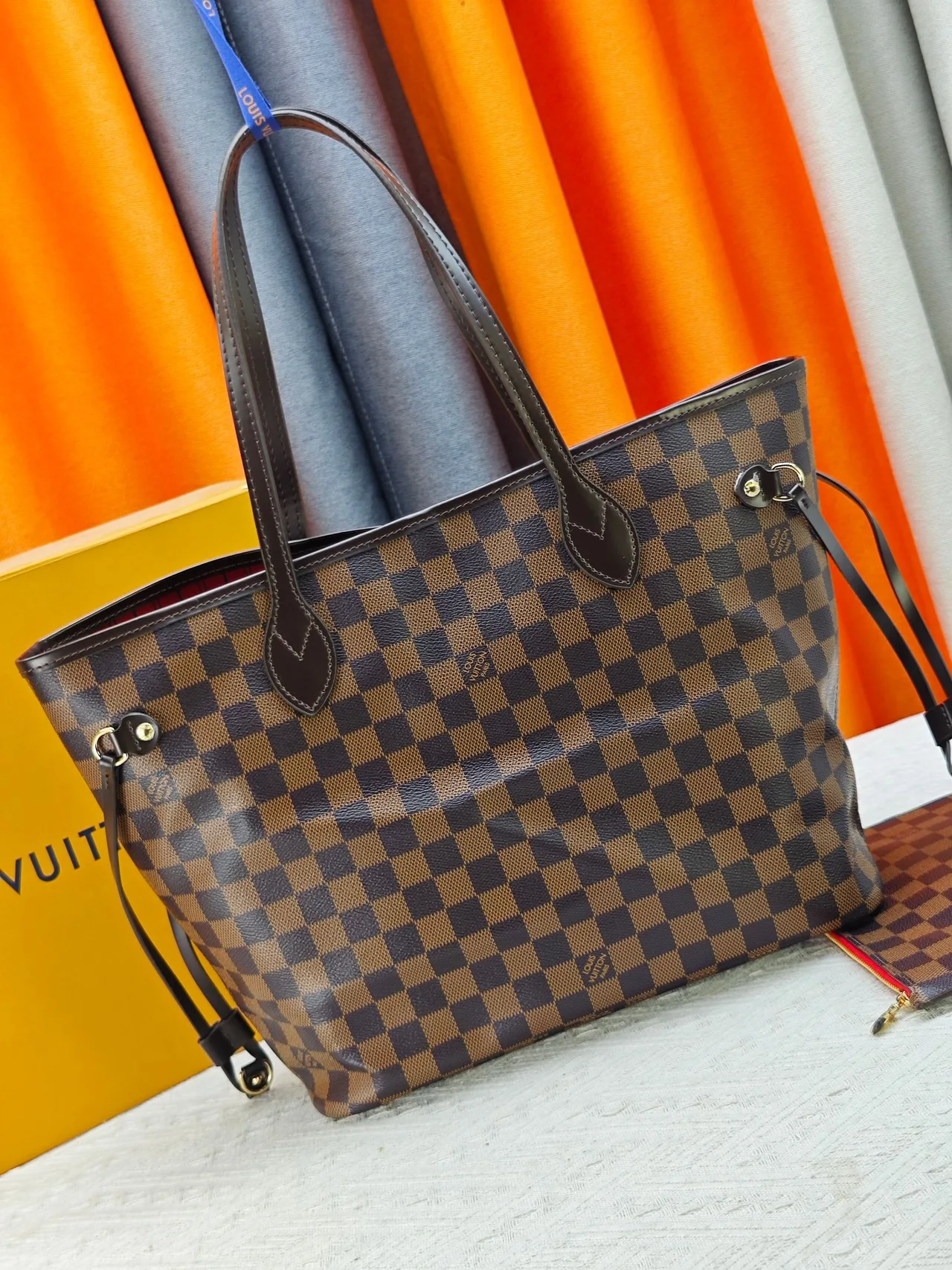 Louis Vuitton Neverfull Clutch in Brown · view 3