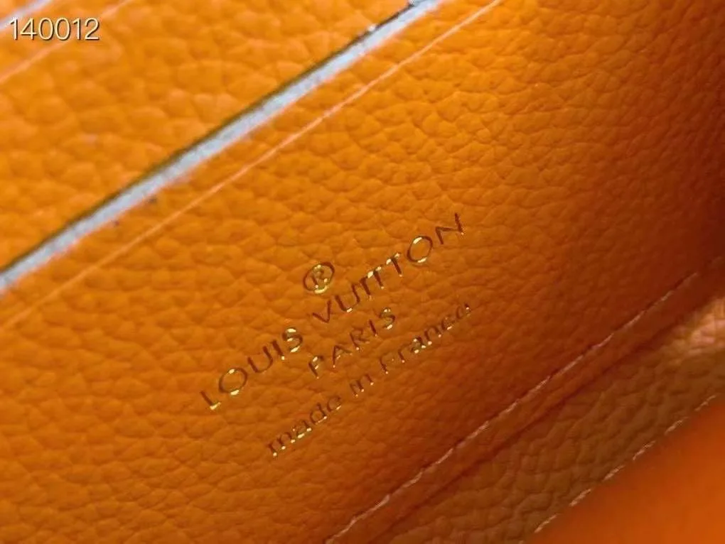 Louis Vuitton Zip Coin Wallet in Orange · view 8