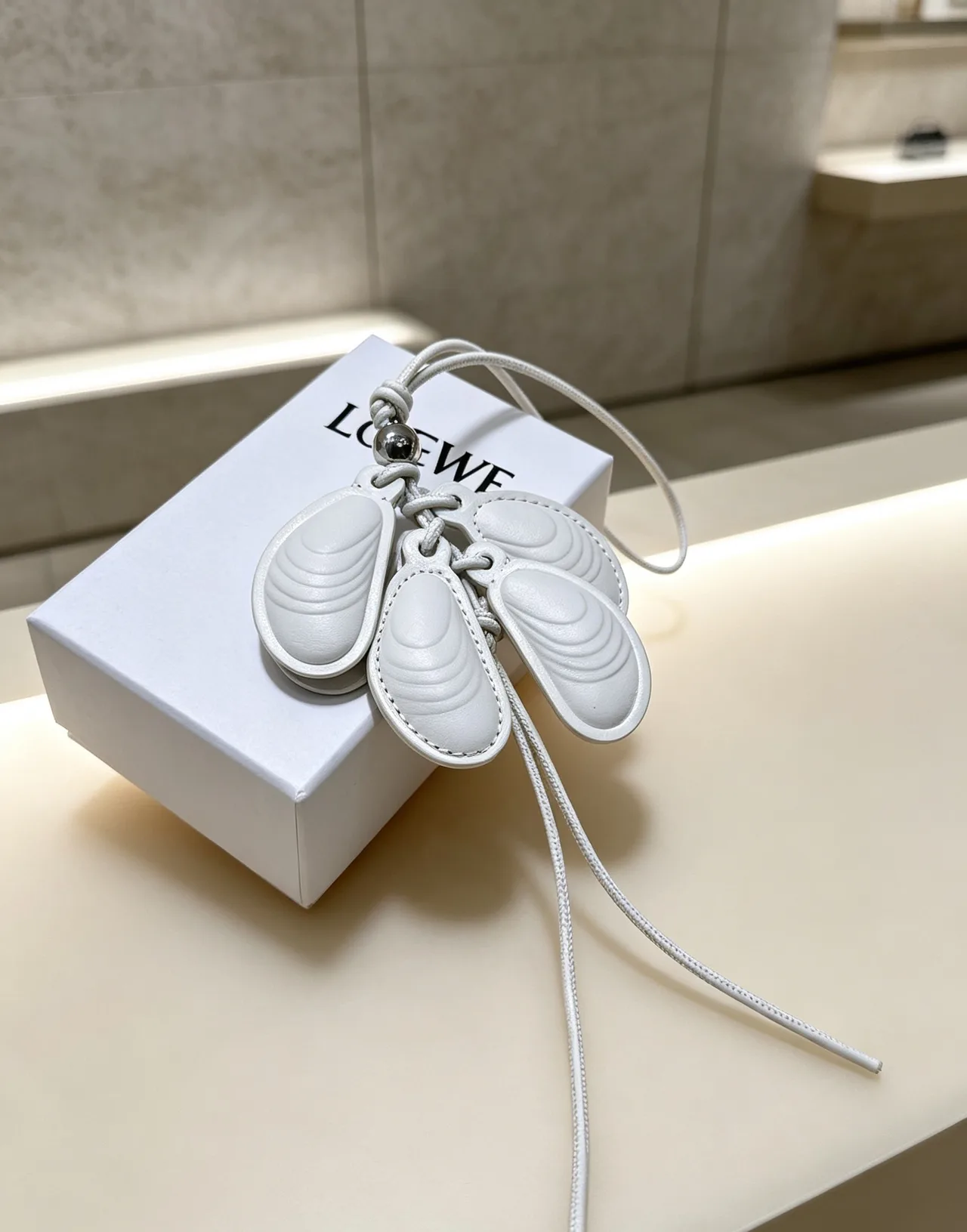 Loewe Leather Shell Bag Charm in White · view 3