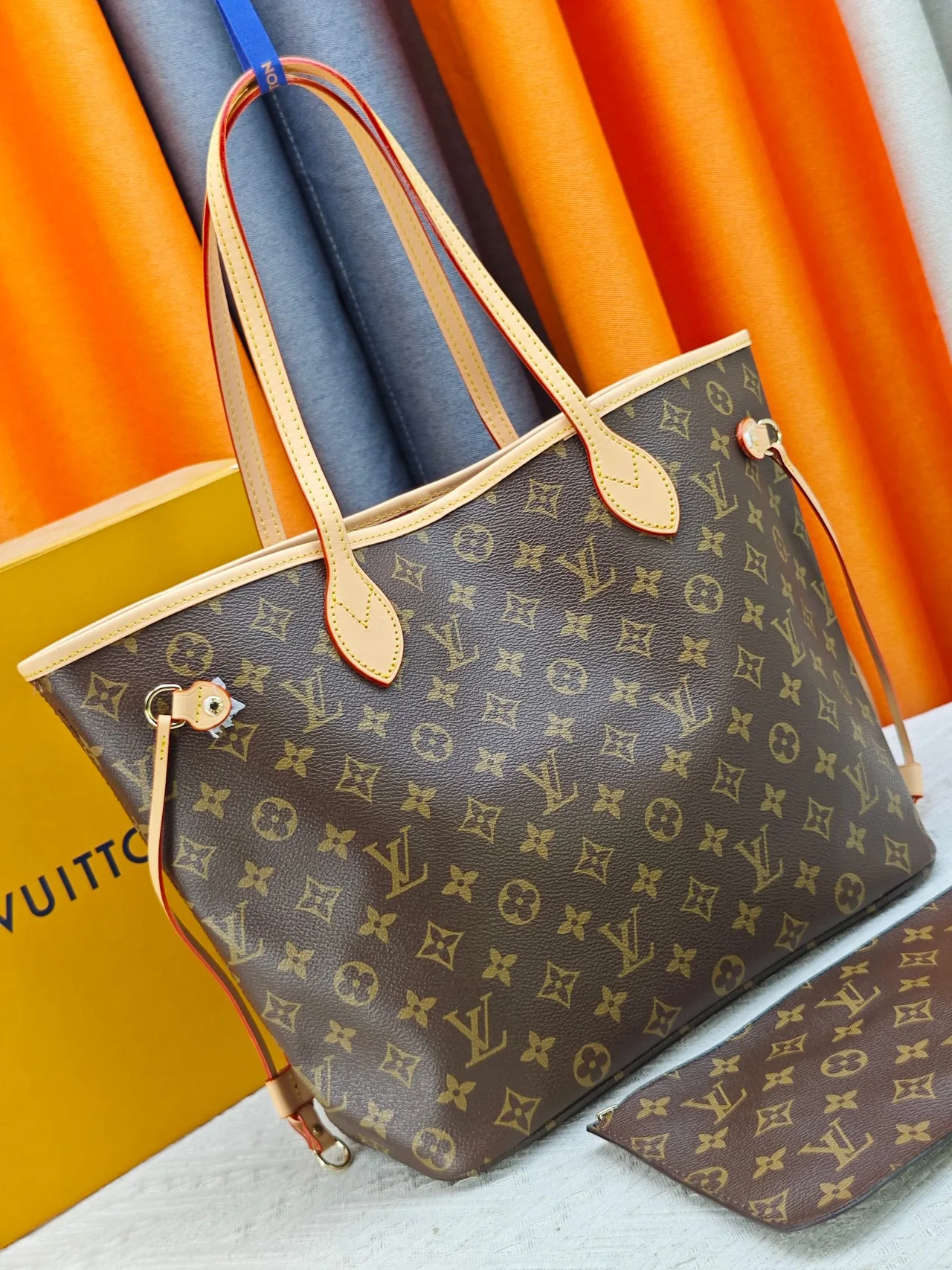 Louis Vuitton Neverfull Clutch in Brown · view 2