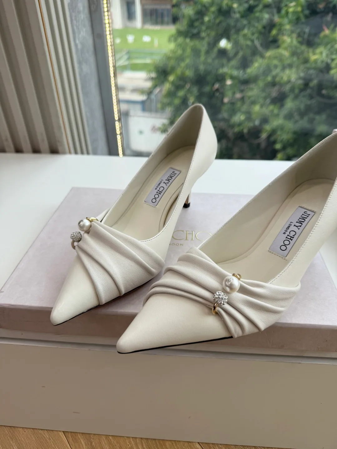 Jimmy Choo Glossy Pointed-Toe Knotted Pointed Pumps in White · view 5