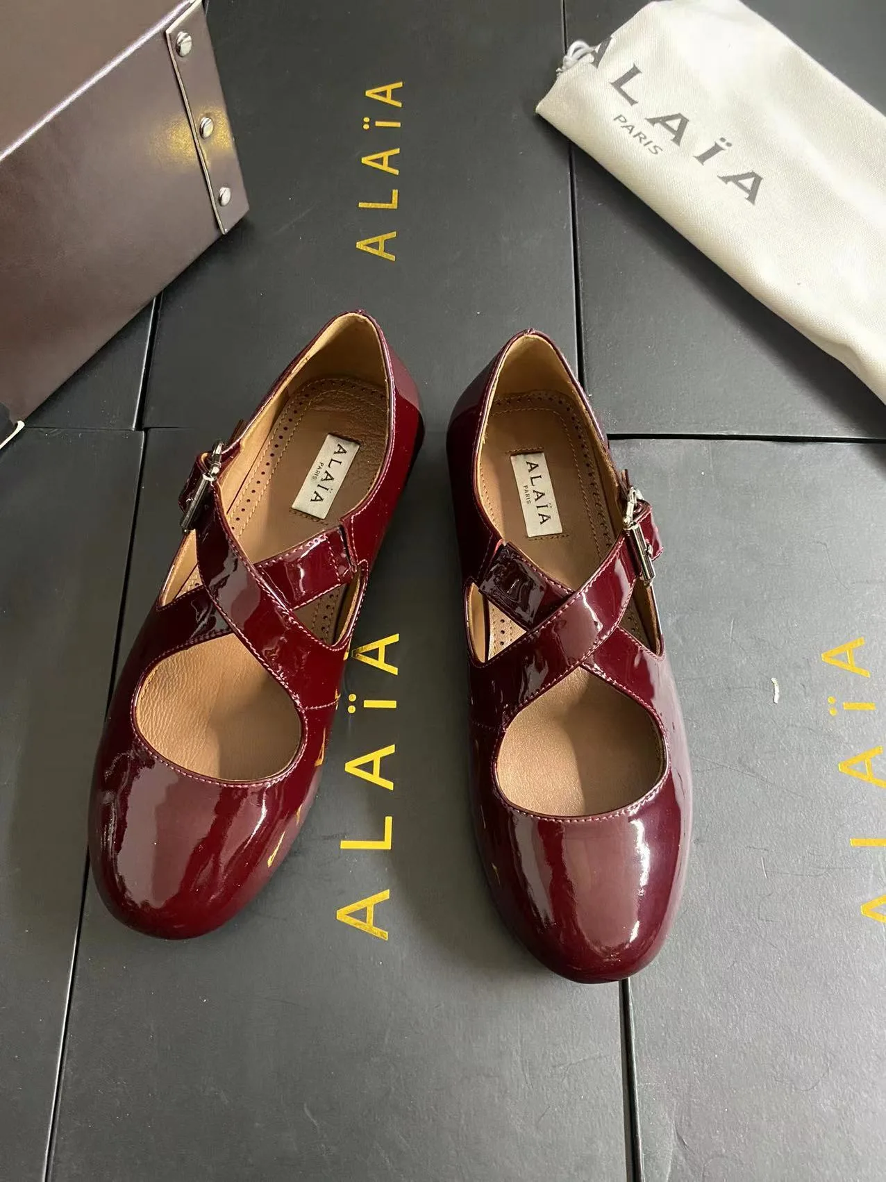 Alaia Cowhide Sheepskin Glossy Square-Toe Buckle Cross-Strap Mary Jane Flats in Burgundy · view 5