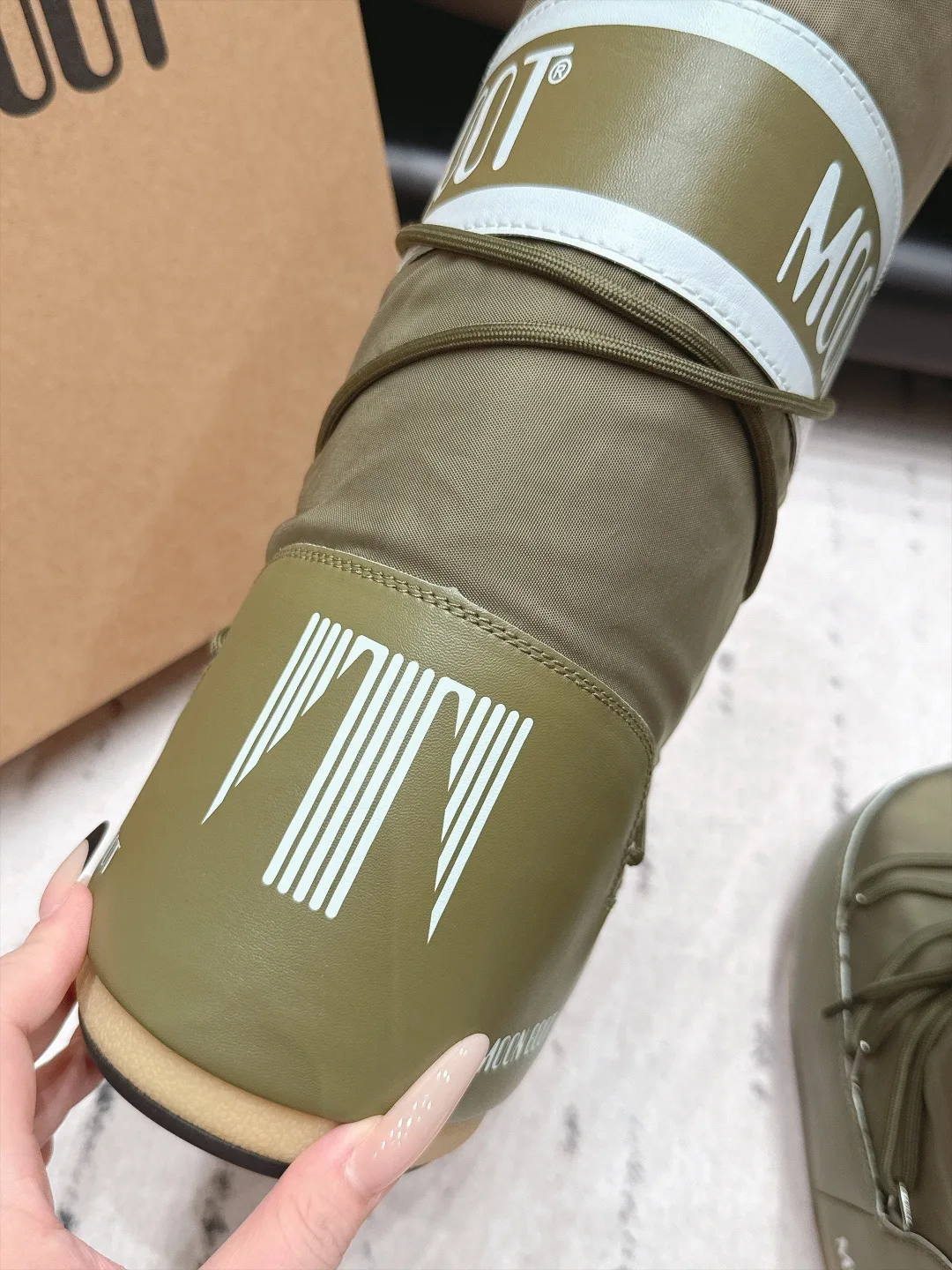 Moon Boot Quilted Boots in Green · view 7