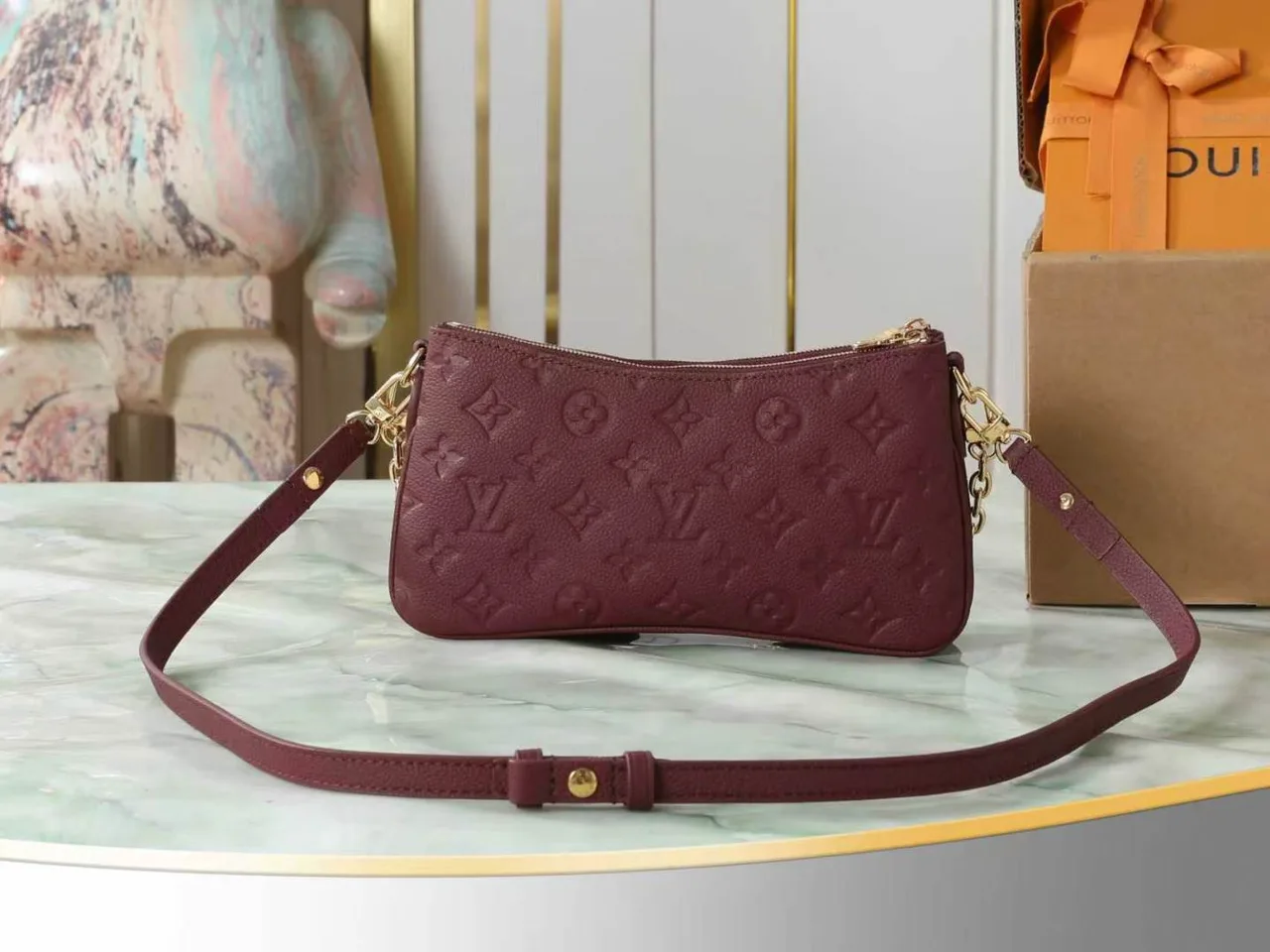 Louis Vuitton Leather Quilted Clutch in Burgundy · view 3