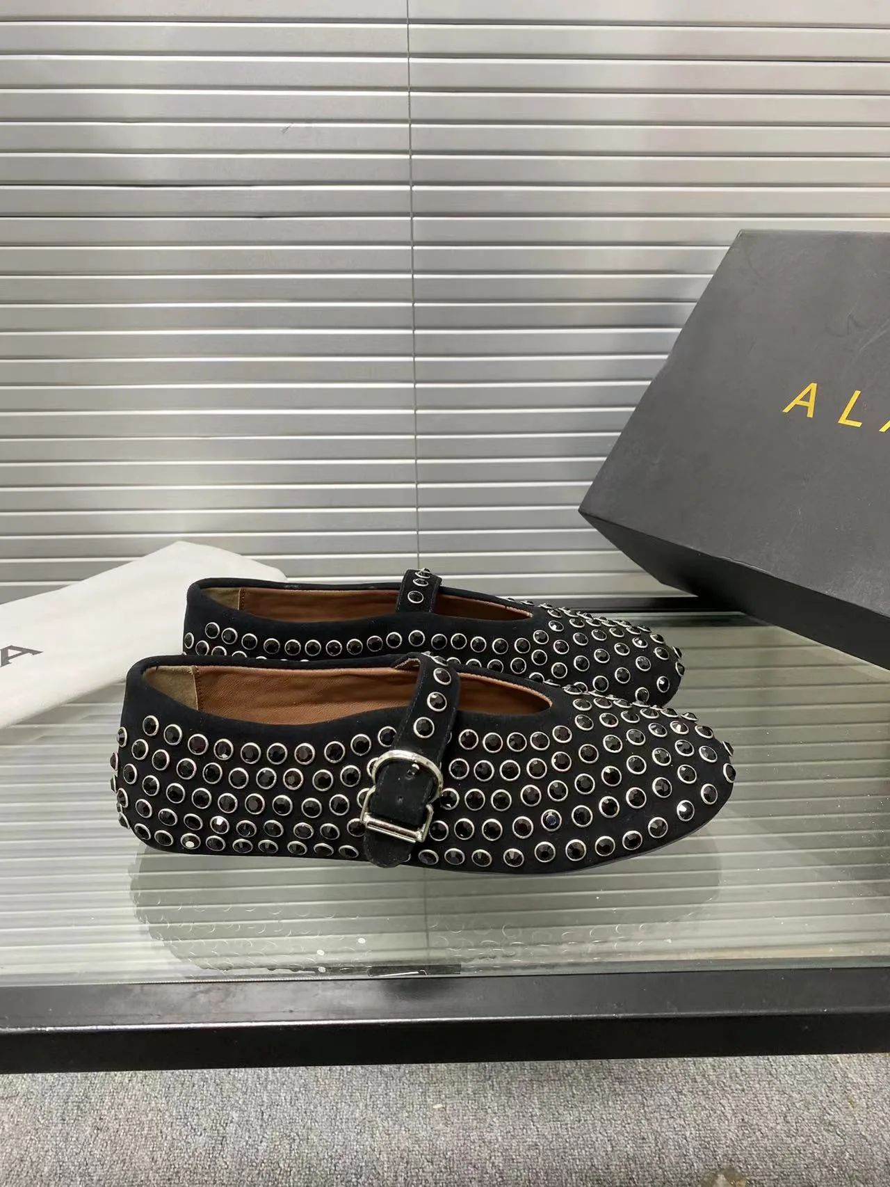 Alaia Cowhide Sheepskin Round-Toe Studded Mary Jane Flats in Black · view 5