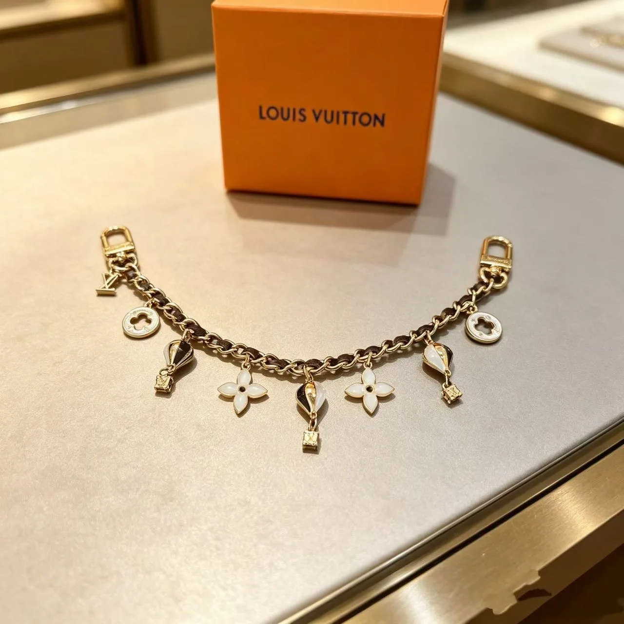 Louis Vuitton Hot-Air-Balloon and Flower Chain Charm in Gold · view 1
