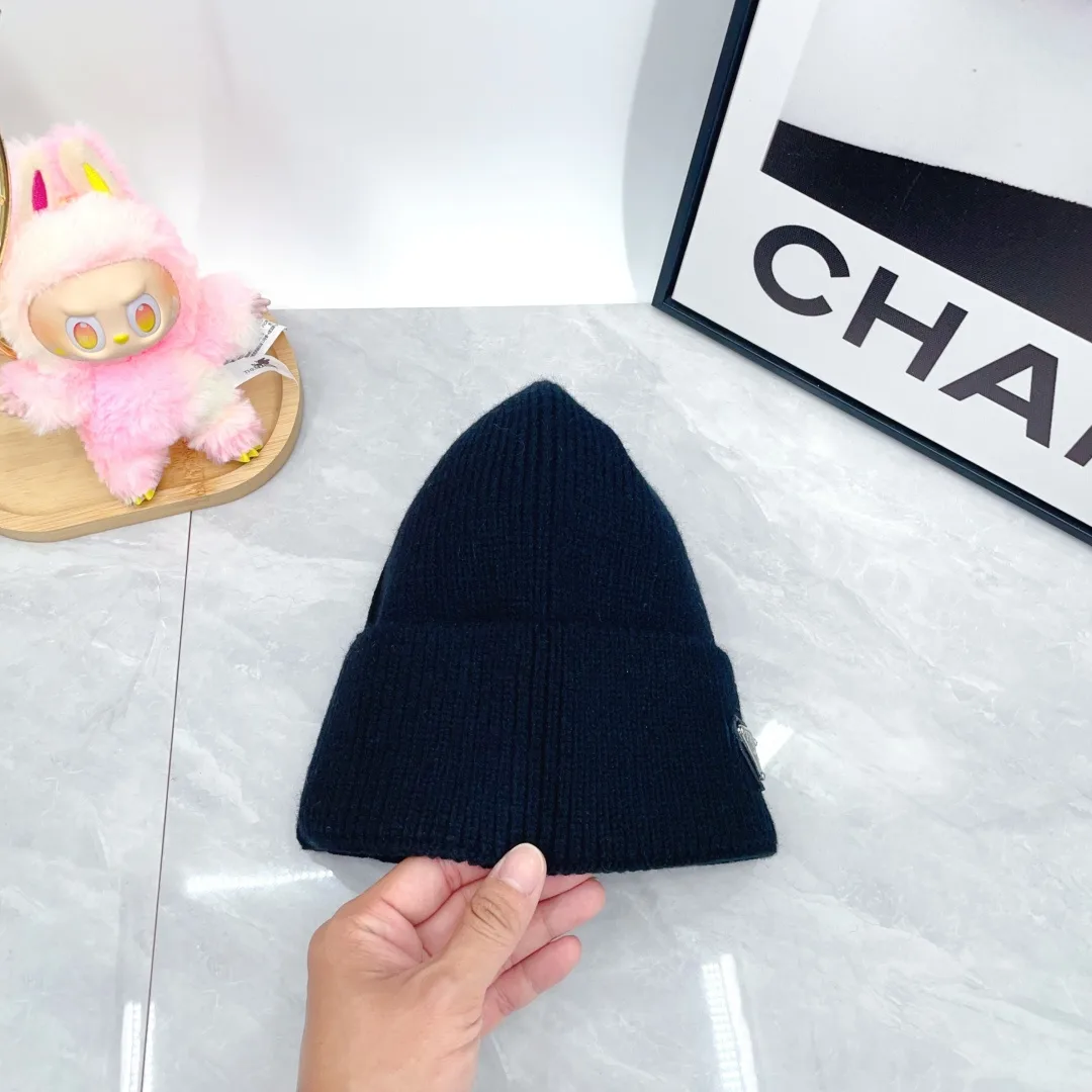 Prada Triangle-Badge Beanie in Black & Grey & White & Beige & Brown & Yellow & Blue & Pink & Red · view 9
