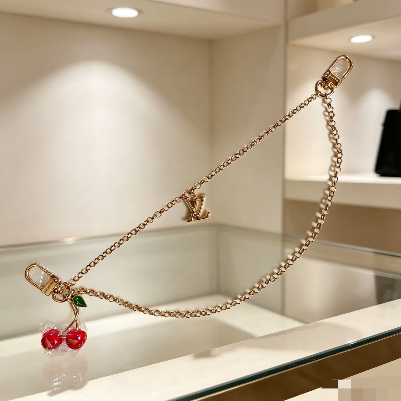 Louis Vuitton Cherry Bag Charm with Chain in Gold · view 1