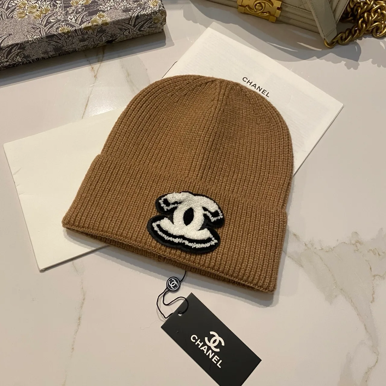 Chanel CC knit beanie in Black / White / Red / Grey / Beige / Tan · view 6