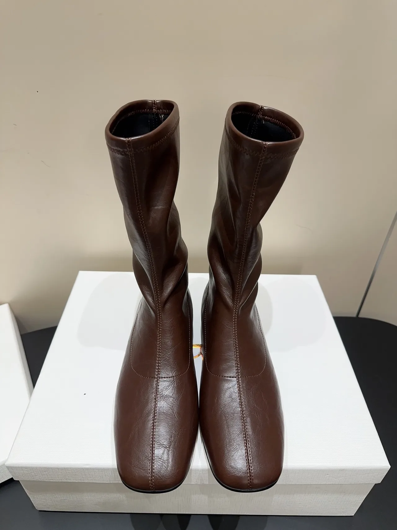 The Row Cowhide Sheepskin Glossy Round-Toe Square-Toe Ankle Boots in Brown · view 1