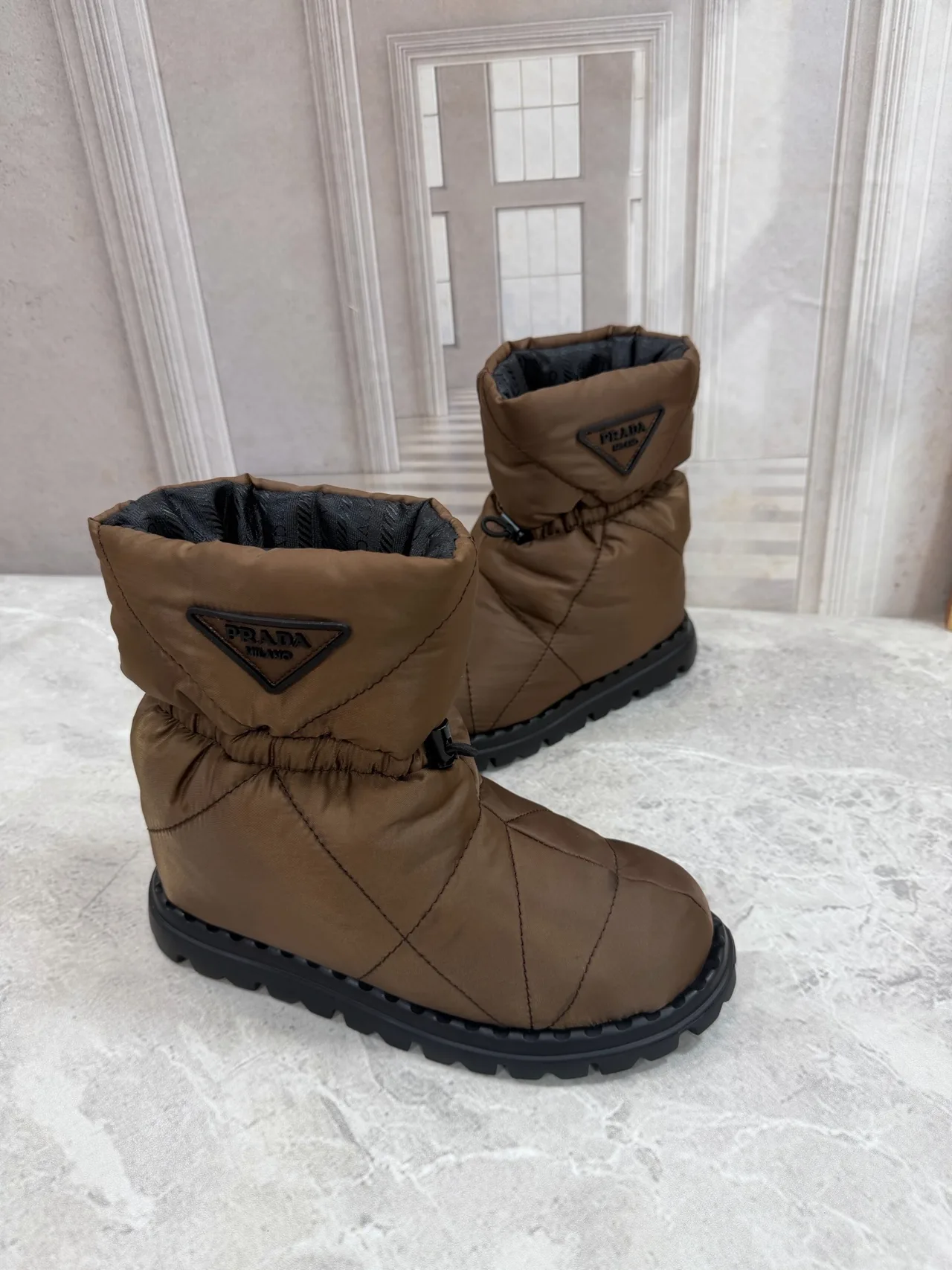 Prada Quilted Round-Toe Puffer Boots in Brown · view 3