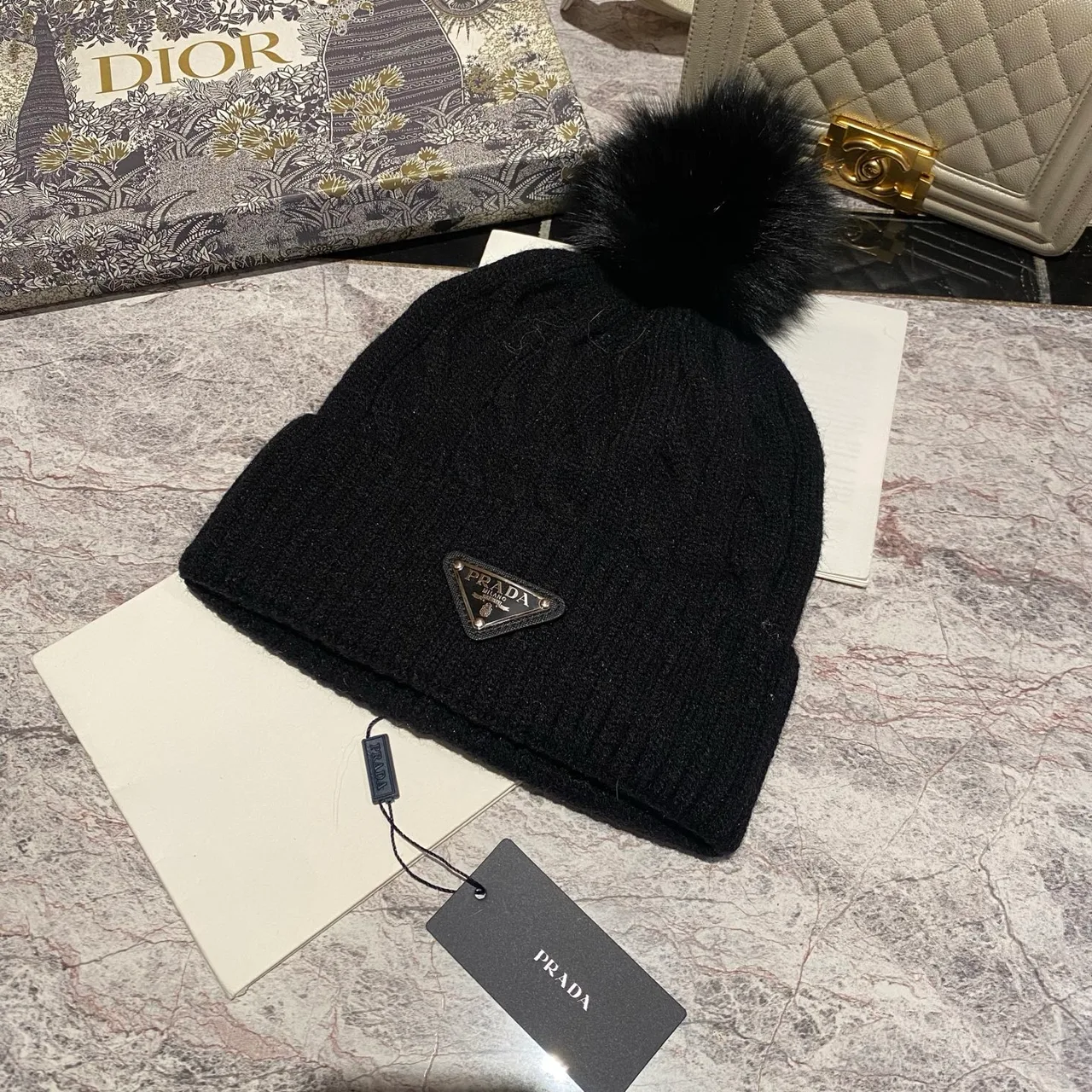 Prada Cable knit pom beanie in Black & White & Grey & Brown & Cream & Blue & Burgundy & Pink · view 1