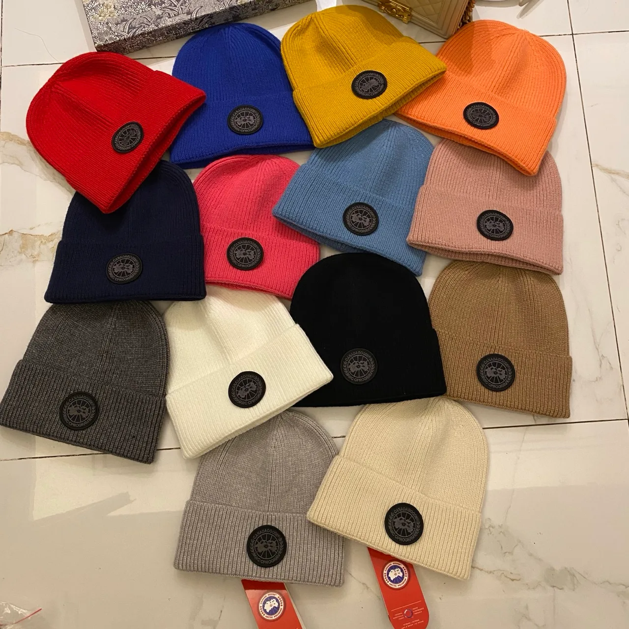 Canada Goose Logo knit beanie in Red & Blue & Yellow & Orange & Pink & Grey & White & Black & Tan & Cream · view 2
