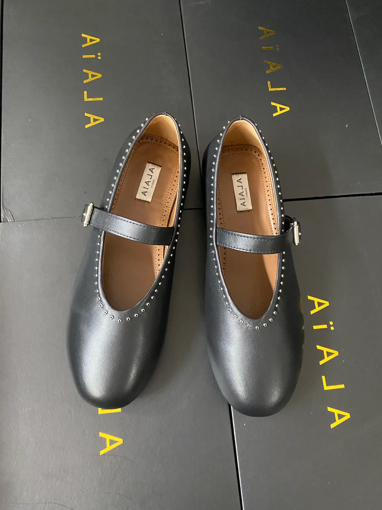 Alaia Cowhide Sheepskin Smooth Round-Toe Mary Jane Flats in Black · view 1