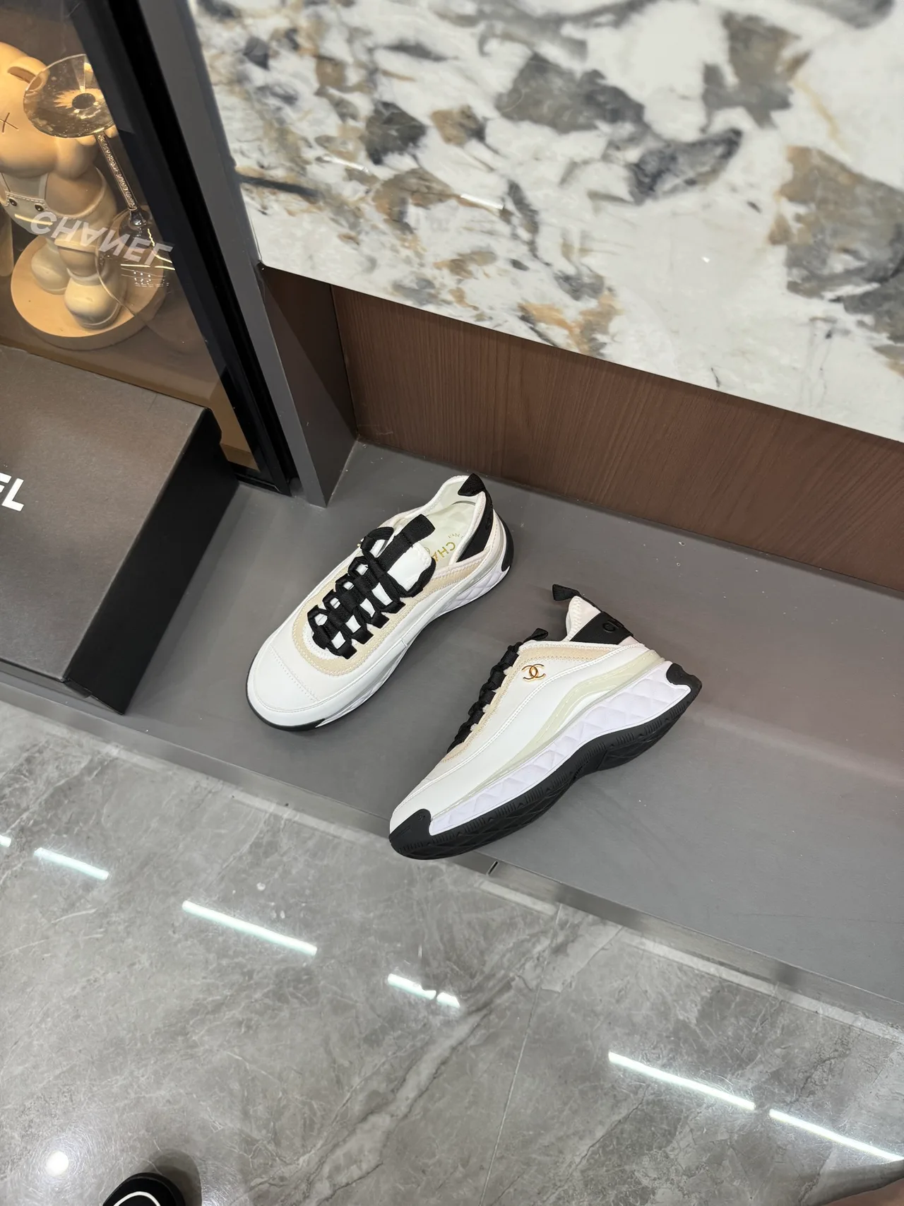 Chanel Cowhide Quilted Lace-Up Sneakers in White · view 6