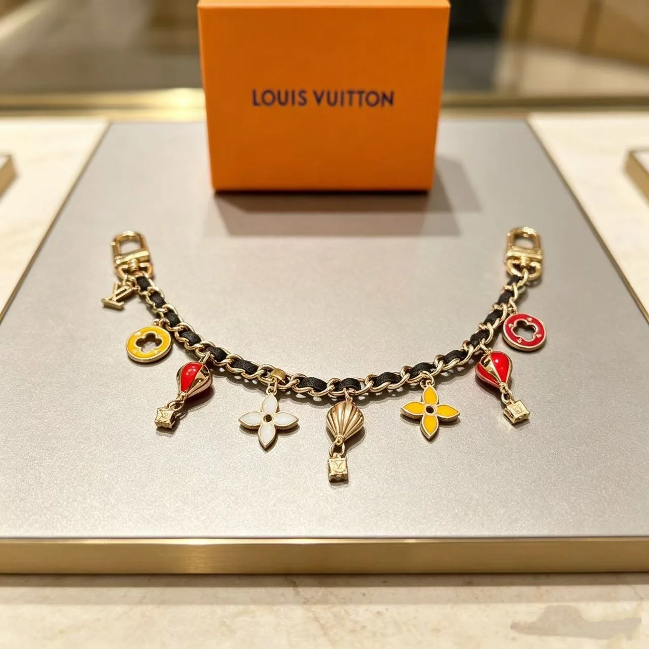 Louis Vuitton Hot-Air-Balloon and Flower Chain Charm in Gold · view 2