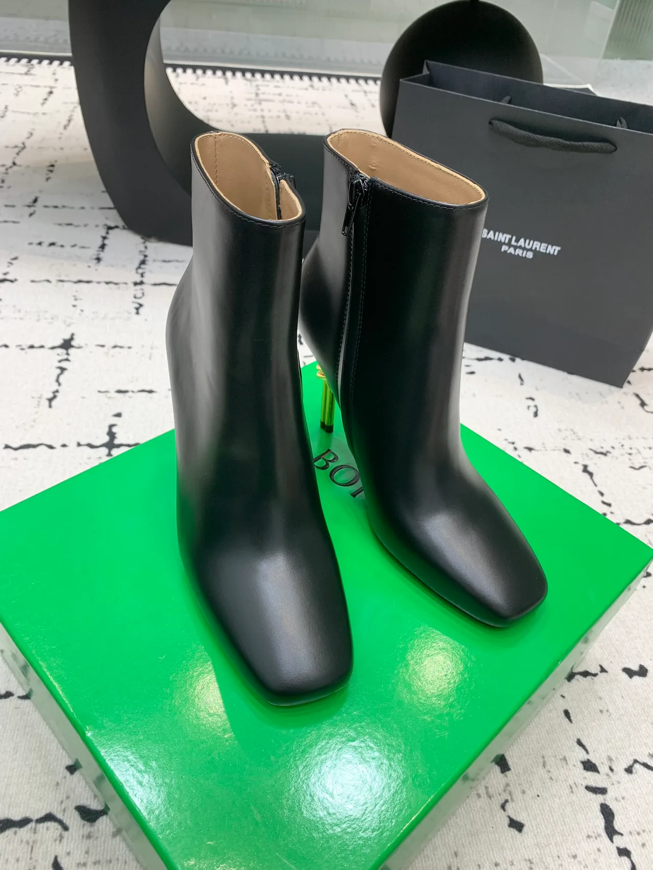 Calfskin Smooth Pointed-Toe Knot-Heel Ankle Boots in Black · view 1