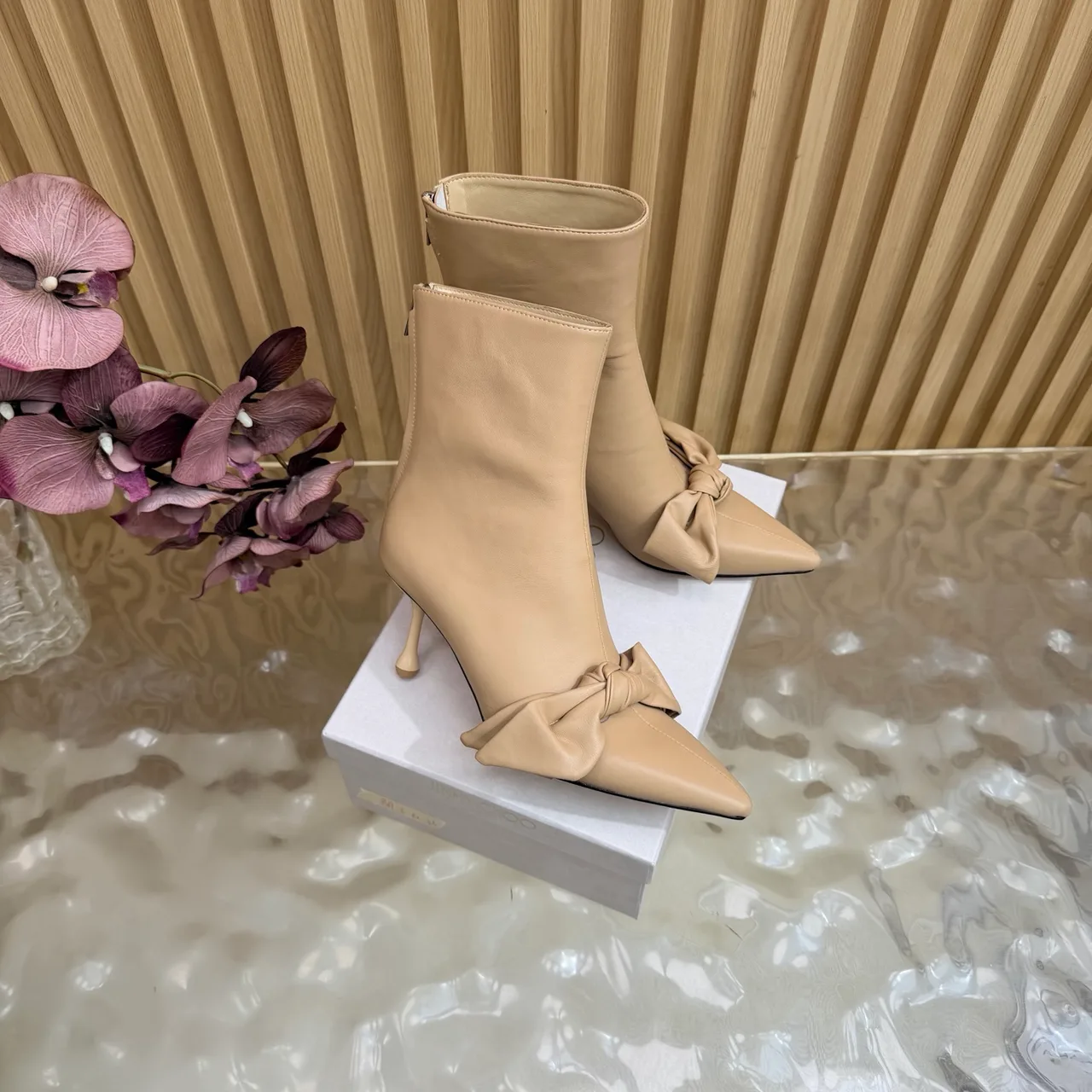 Jimmy Choo Cowhide Glossy Pointed-Toe Bow Ankle Boots in Beige · view 2