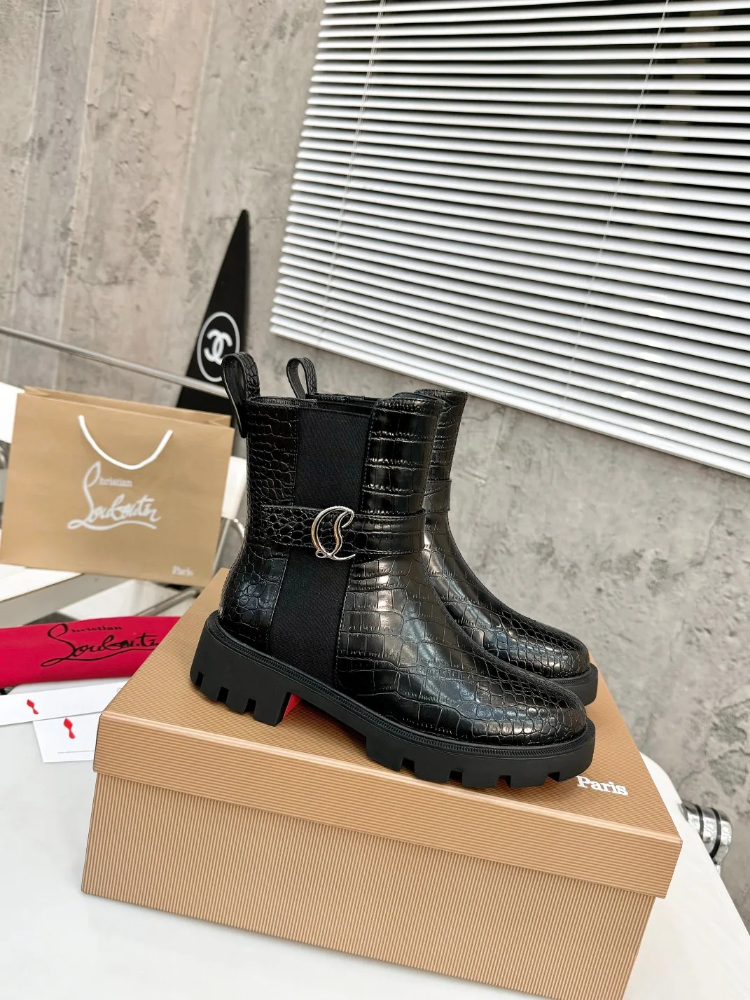 Christian Louboutin Glossy Buckle Ankle Boots in Black · view 1