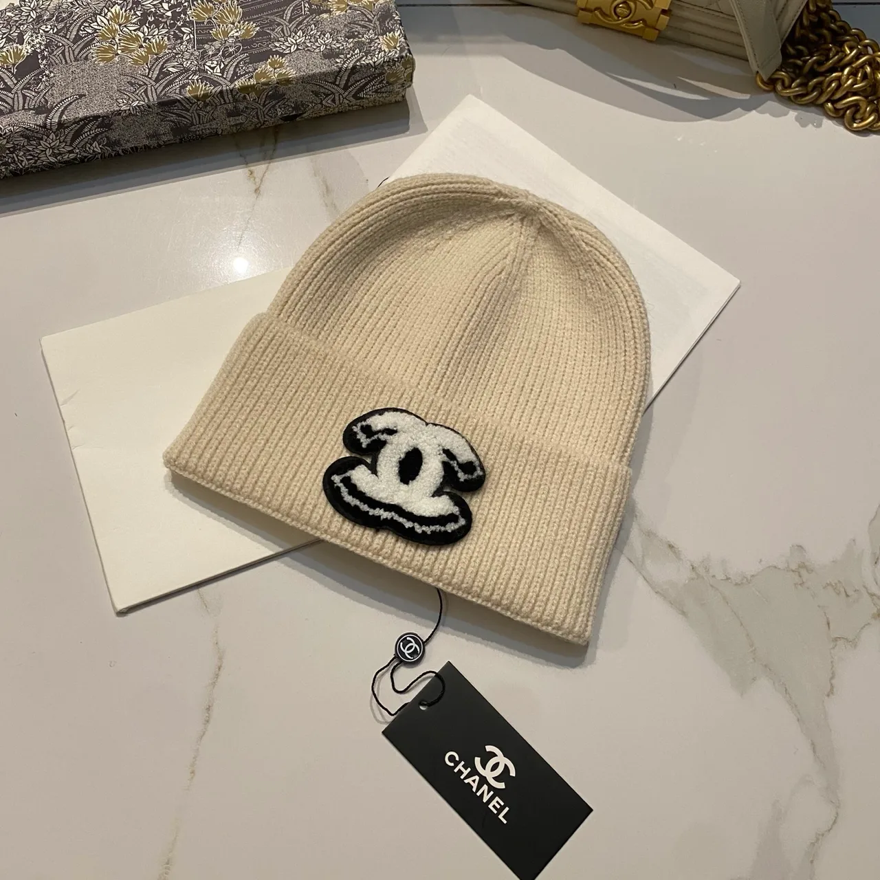 Chanel CC knit beanie in Black / White / Red / Grey / Beige / Tan · view 5